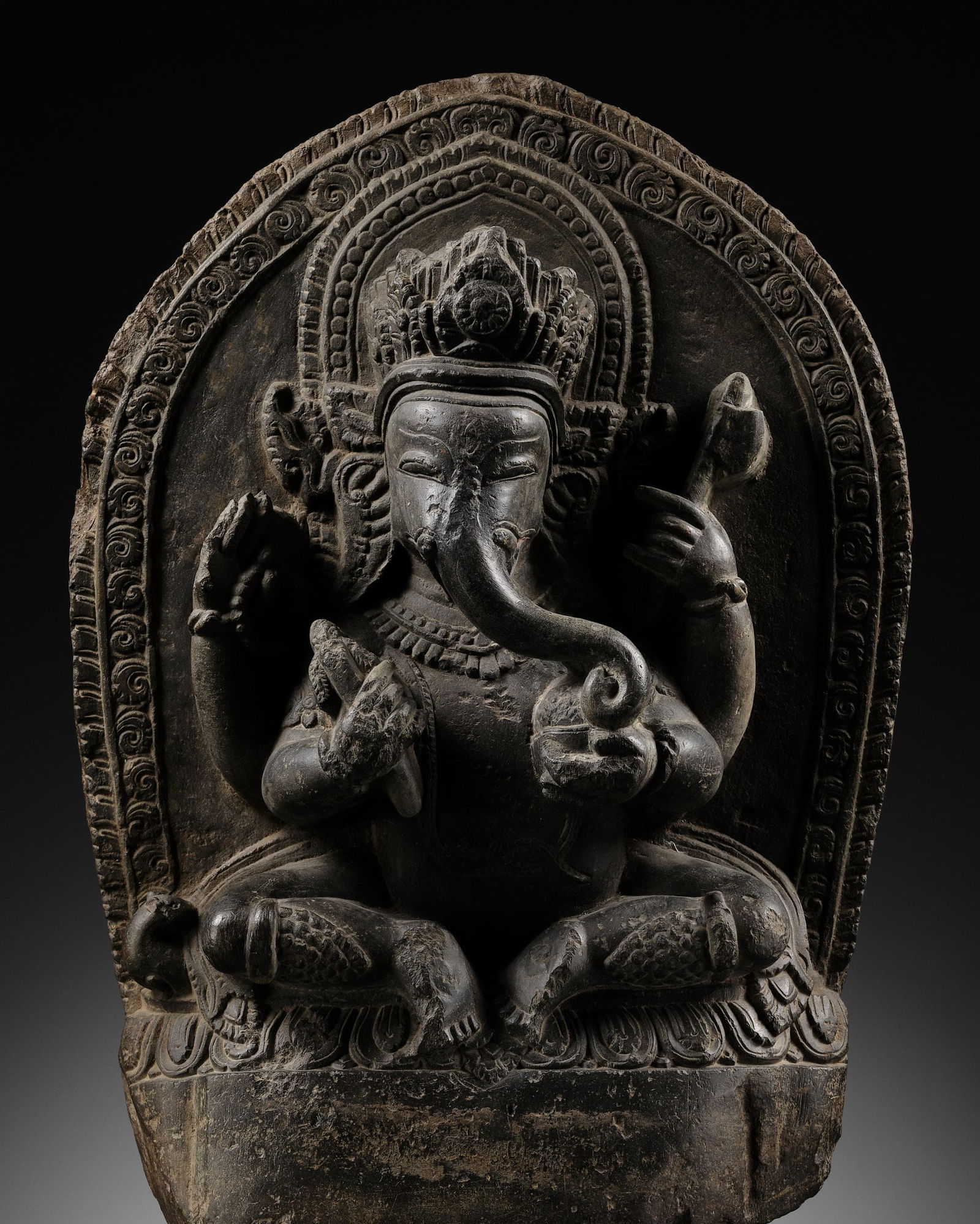 A BLACK STONE STELE OF GANESHA, NEPAL, 17TH-18TH CENTURY (1 of 14)