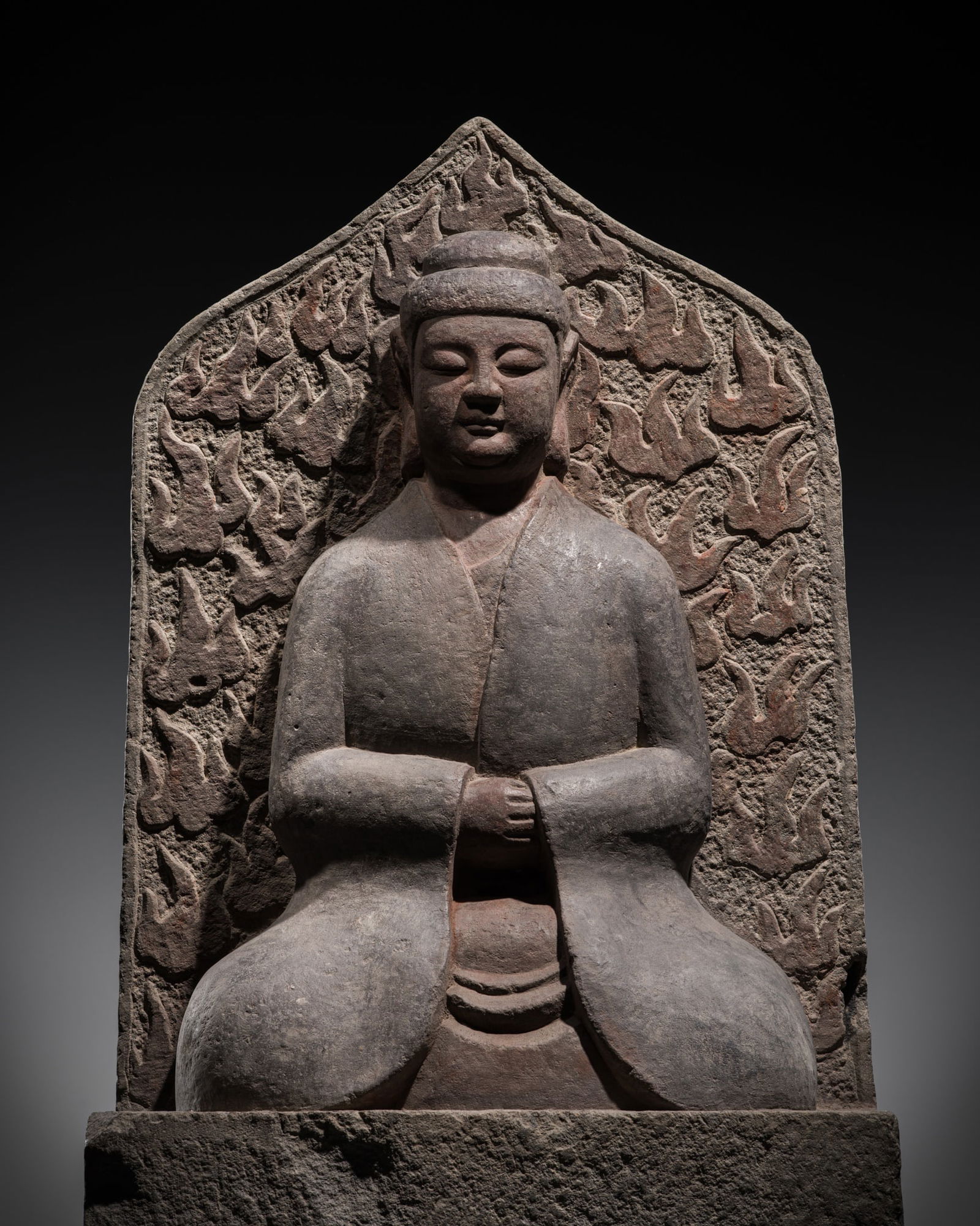 A POLYCHROME LIMESTONE STELE OF THE SEATED BUDDHA BEFORE A FLAMING MANDORLA, EASTERN WEI DYNASTY (1 of 15)