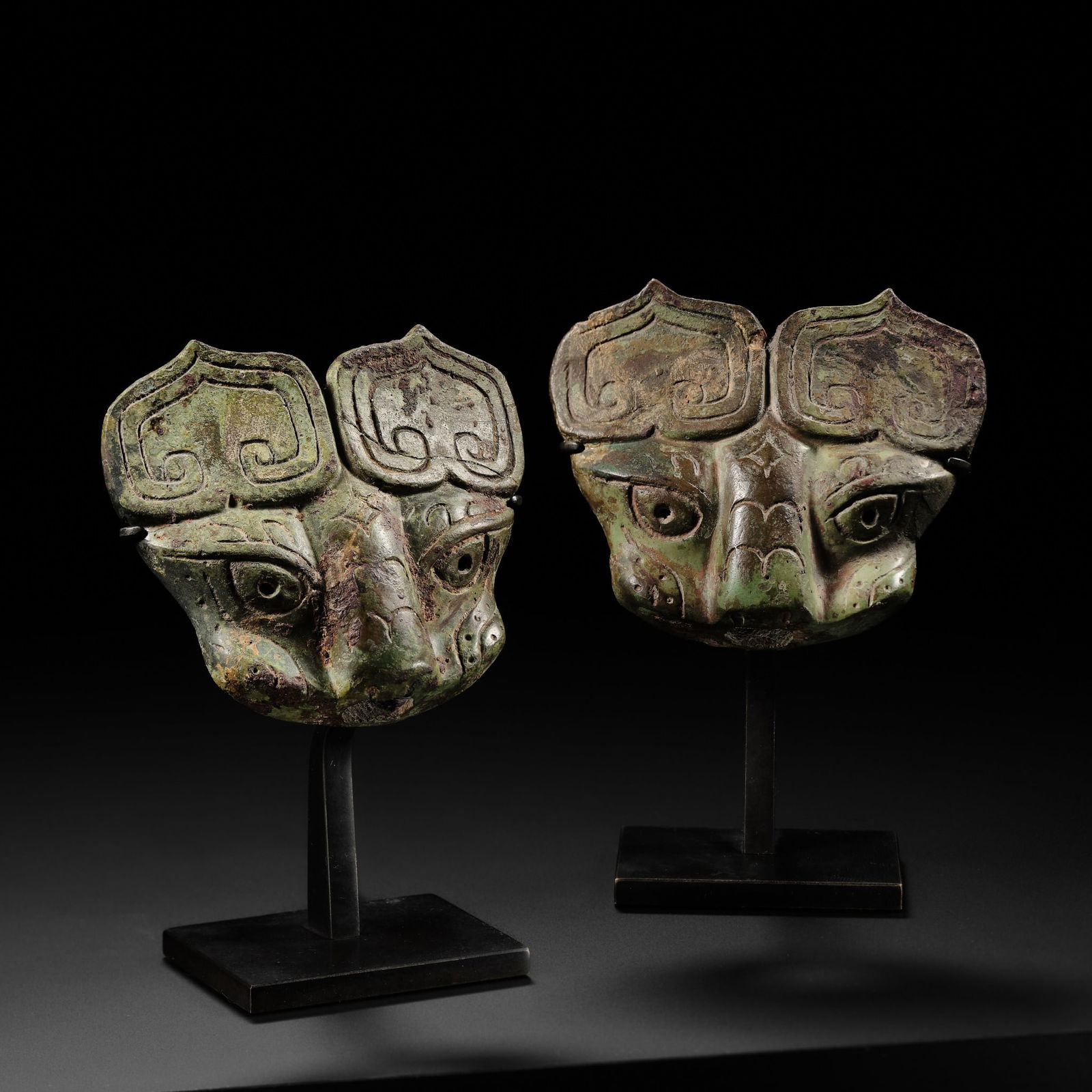 A PAIR OF BRONZE 'TAOTIE' HORSE HARNESS FITTINGS, WESTERN ZHOU DYNASTY: A PAIR OF BRONZE 'TAOTIE' HORSE HARNESS FITTINGS, WESTERN ZHOU DYNASTY Published: Martin Doustar, Austronesia & Beyond, published on the occasion of the international fair of non-European traditio