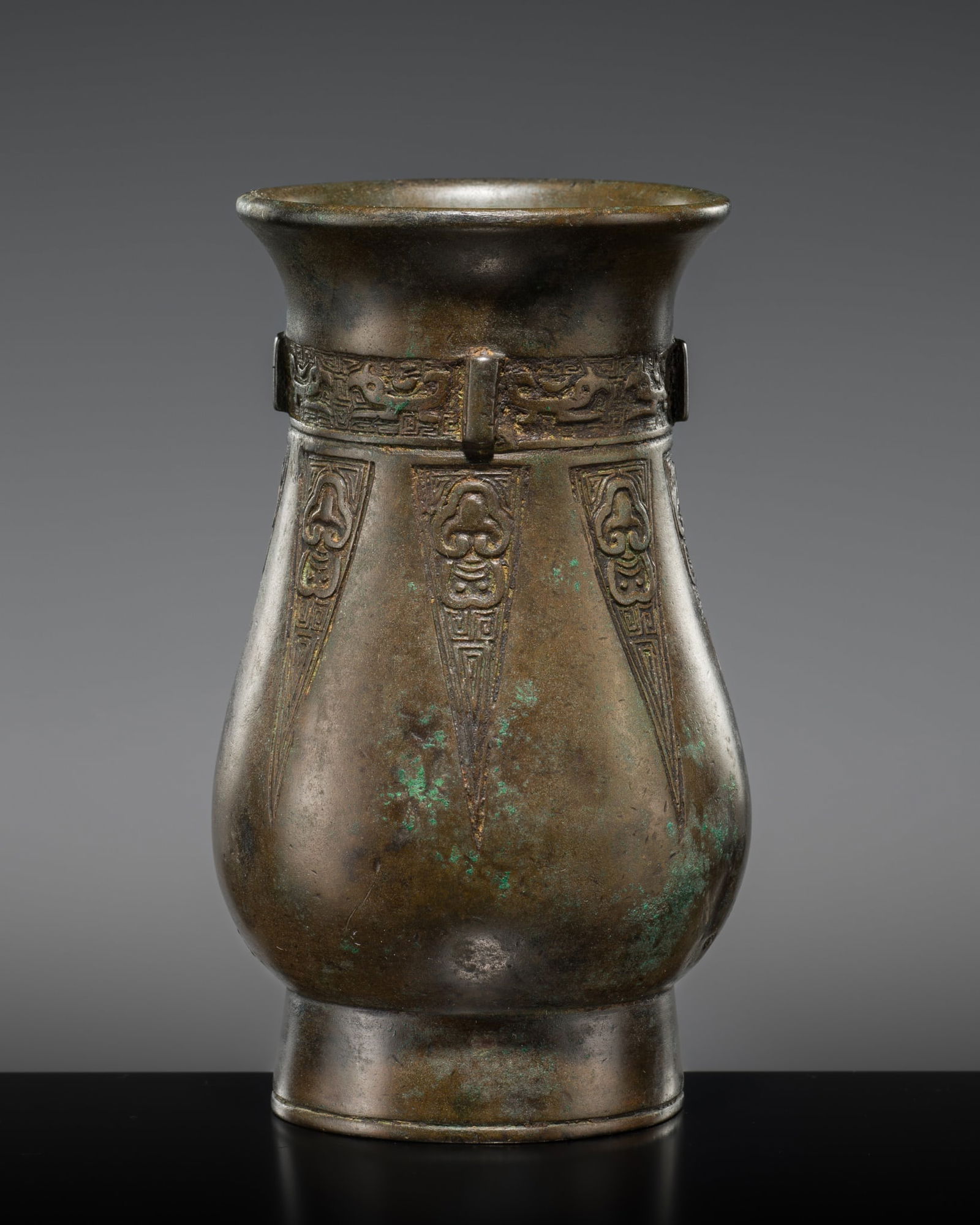 AN ARCHAIC BRONZE RITUAL WINE VESSEL, ZHI, WESTERN ZHOU DYNASTY, 1046-771 BC (1 of 12)