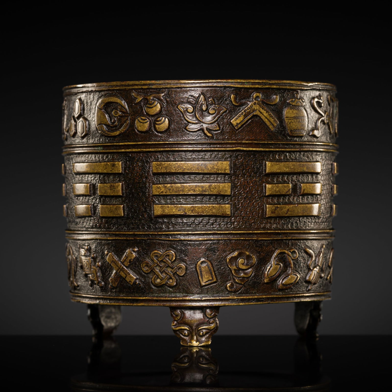 A HU WENMING PARCEL-GILT BRONZE 'BA GUA' TRIPOD CENSER, 17TH CENTURY (1 of 12)