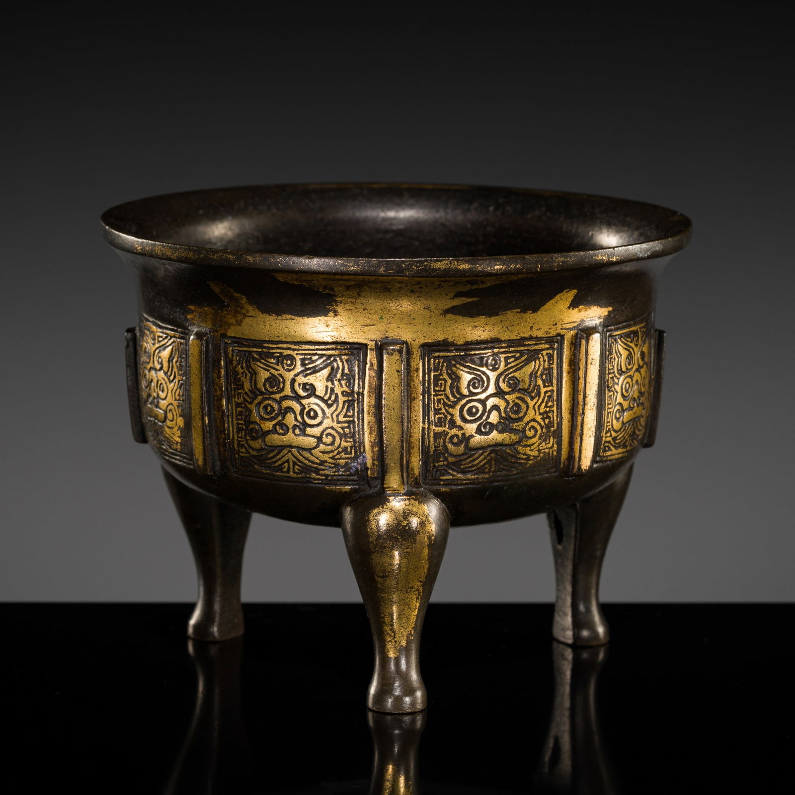 A PARCEL-GILT BRONZE TRIPOD CENSER, 17TH-18TH CENTURY (1 of 12)