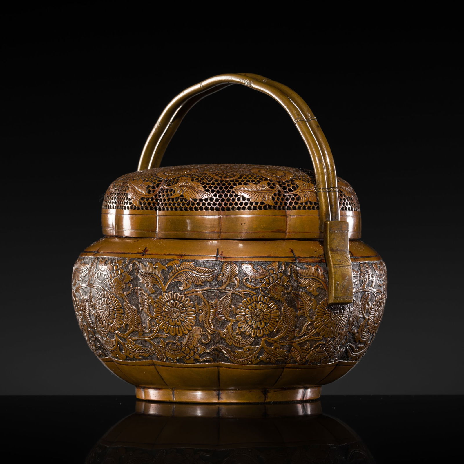 A COPPER-ALLOY 'CHRYSANTHEMUMS AND BUTTERFLIES' HANDWARMER, 17TH-18TH CENTURY (1 of 16)