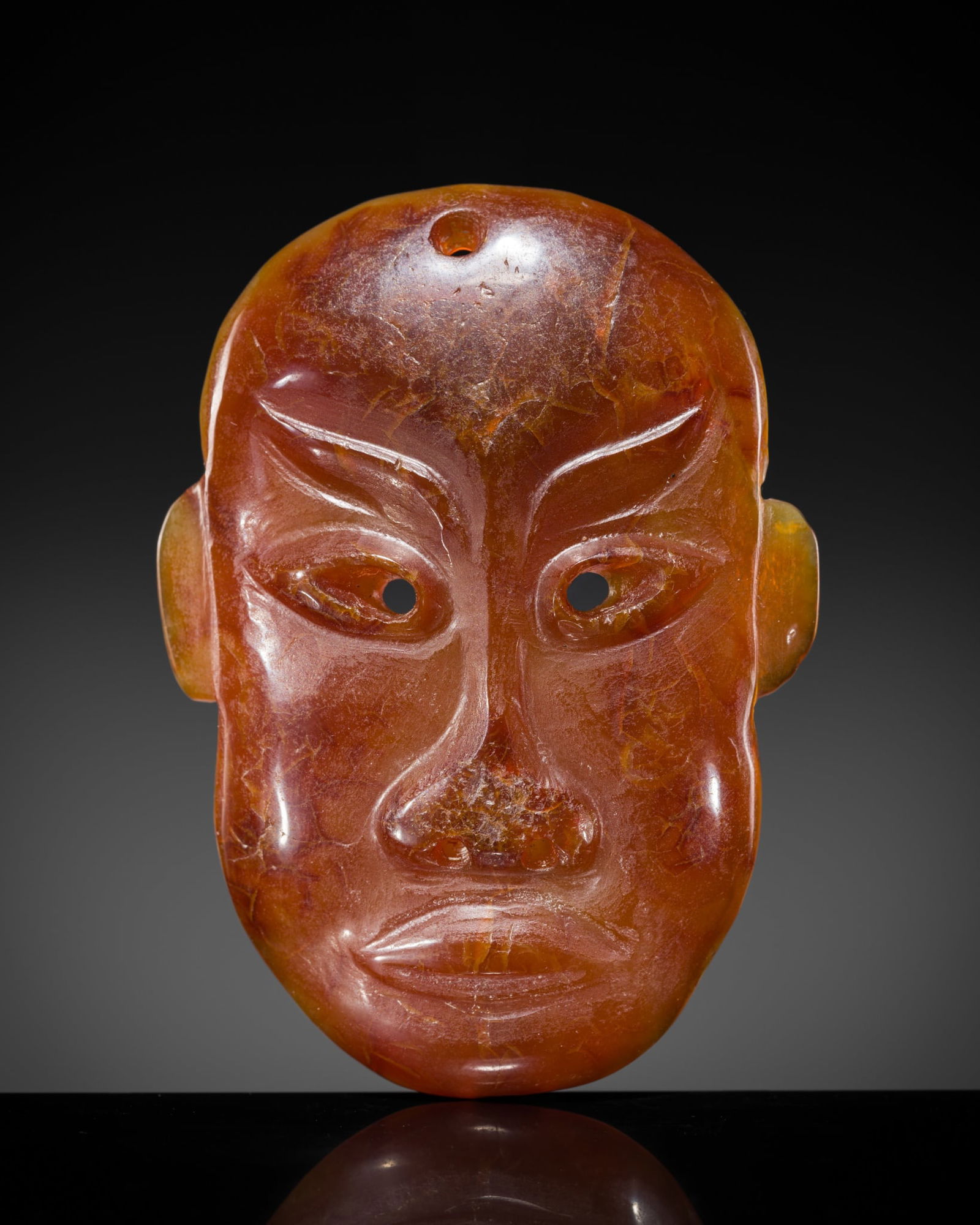 A RARE AGATE 'PORTRAIT MASK' PENDANT, LIAO DYNASTY (1 of 11)