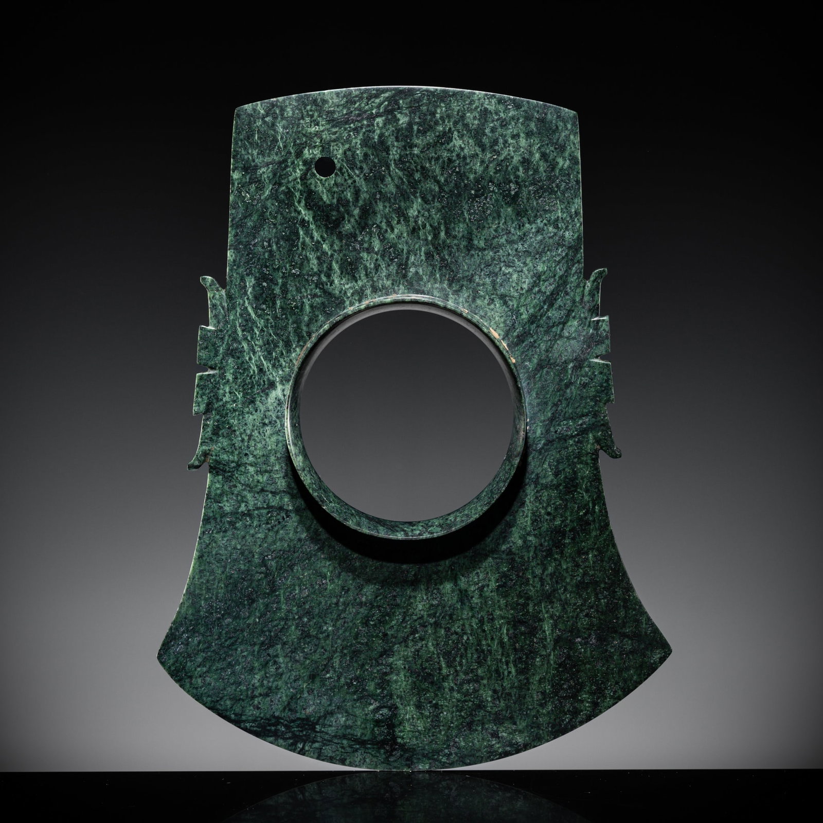 A RARE MOTTLED GREEN JADE COLLARED AXE, YUE, LATE SHANG DYNASTY: A RARE MOTTLED GREEN JADE COLLARED AXE, YUE, LATE SHANG DYNASTY Expert authentication: Dr. Gu Fang has examined the present lot and confirms its authenticity and the dating above. He assessed it as a