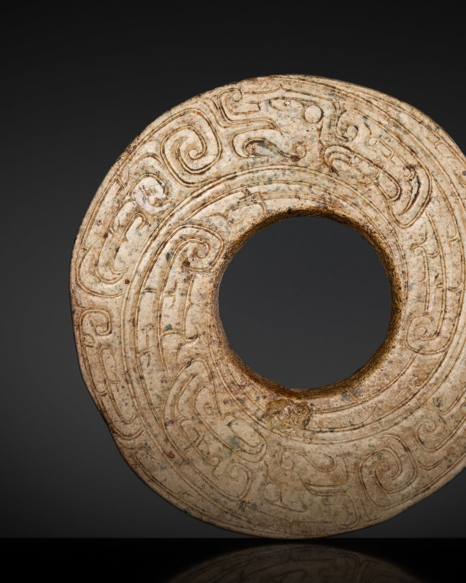 A JADE 'DRAGON' DISK, HUAN, WESTERN ZHOU DYNASTY (1 of 11)