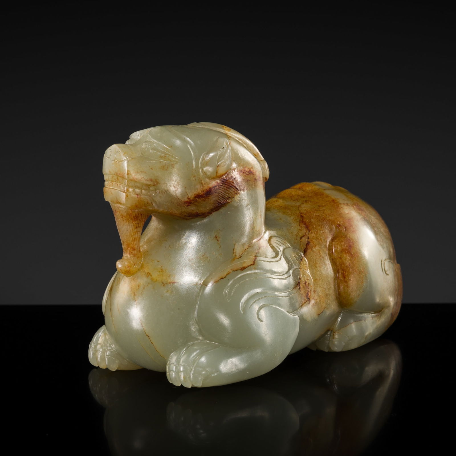 A PALE CELADON AND RUSSET FIGURE OF A BIXIE, YUAN TO MING DYNASTY (1 of 11)