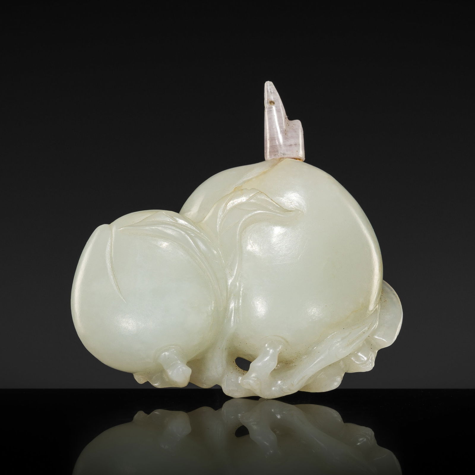 A WHITE JADE 'PEACHES AND BAT' SNUFF BOTTLE, 18TH TO EARLY 19TH CENTURY: A WHITE JADE 'PEACHES AND BAT' SNUFF BOTTLE, 18TH TO EARLY 19TH CENTURY China. Carved in the round and reticulated to depict a bat resting on one of two peaches borne on a leafy branch. The semi-trans