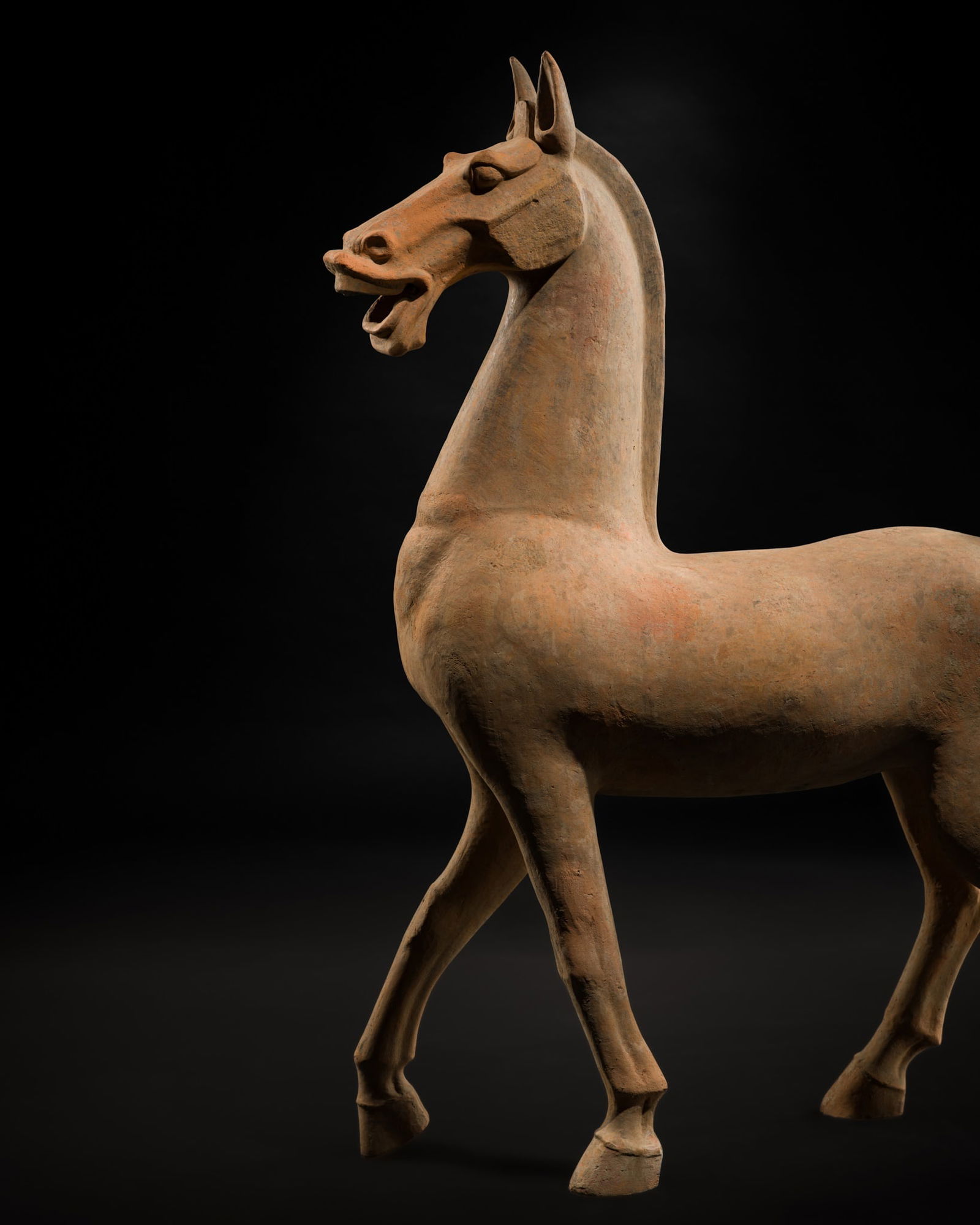 A LARGE SICHUAN POTTERY FIGURE OF A HORSE, EASTERN HAN DYNASTY, LENGTH 101 CM: A LARGE SICHUAN POTTERY FIGURE OF A HORSE, EASTERN HAN DYNASTY, LENGTH 101 CM Scientific Analysis Report: A thermoluminescence analysis report issued by Oxford Authentication on 29 May 2002, based on