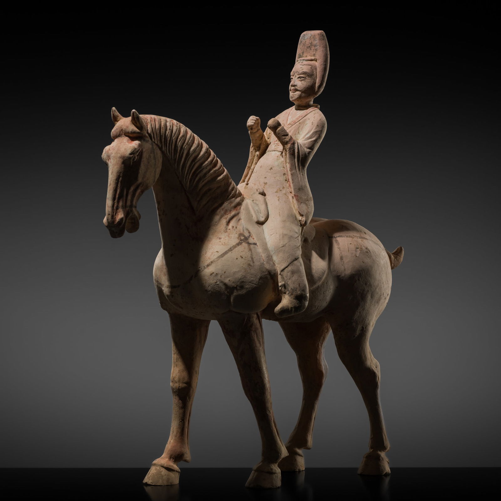 A PAINTED POTTERY FIGURE OF A HORSE AND RIDER, TANG DYNASTY (1 of 20)