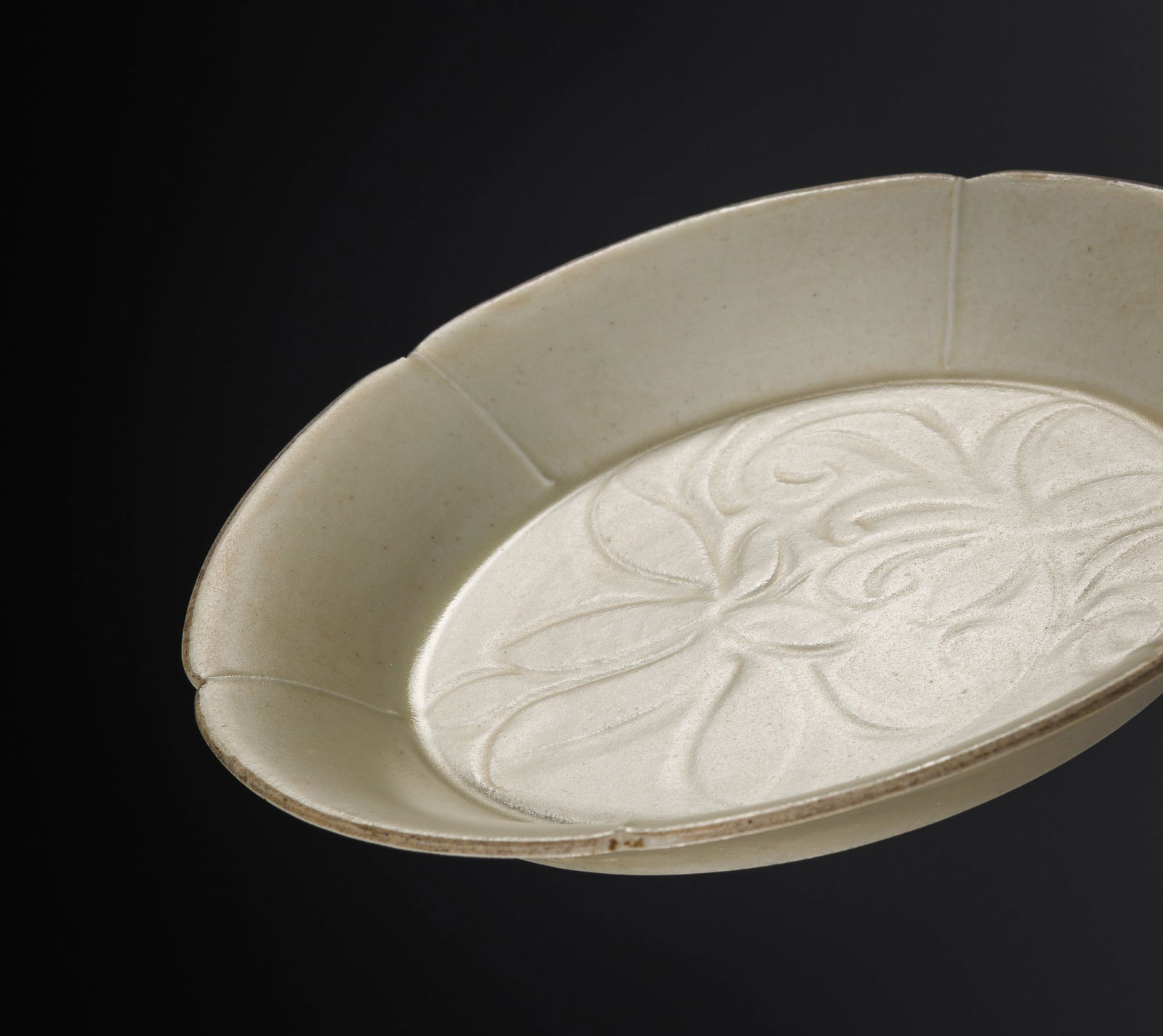 A HEXALOBED AND CARVED DING 'LOTUS' DISH, NORTHERN SONG TO JIN DYNASTY (1 of 13)