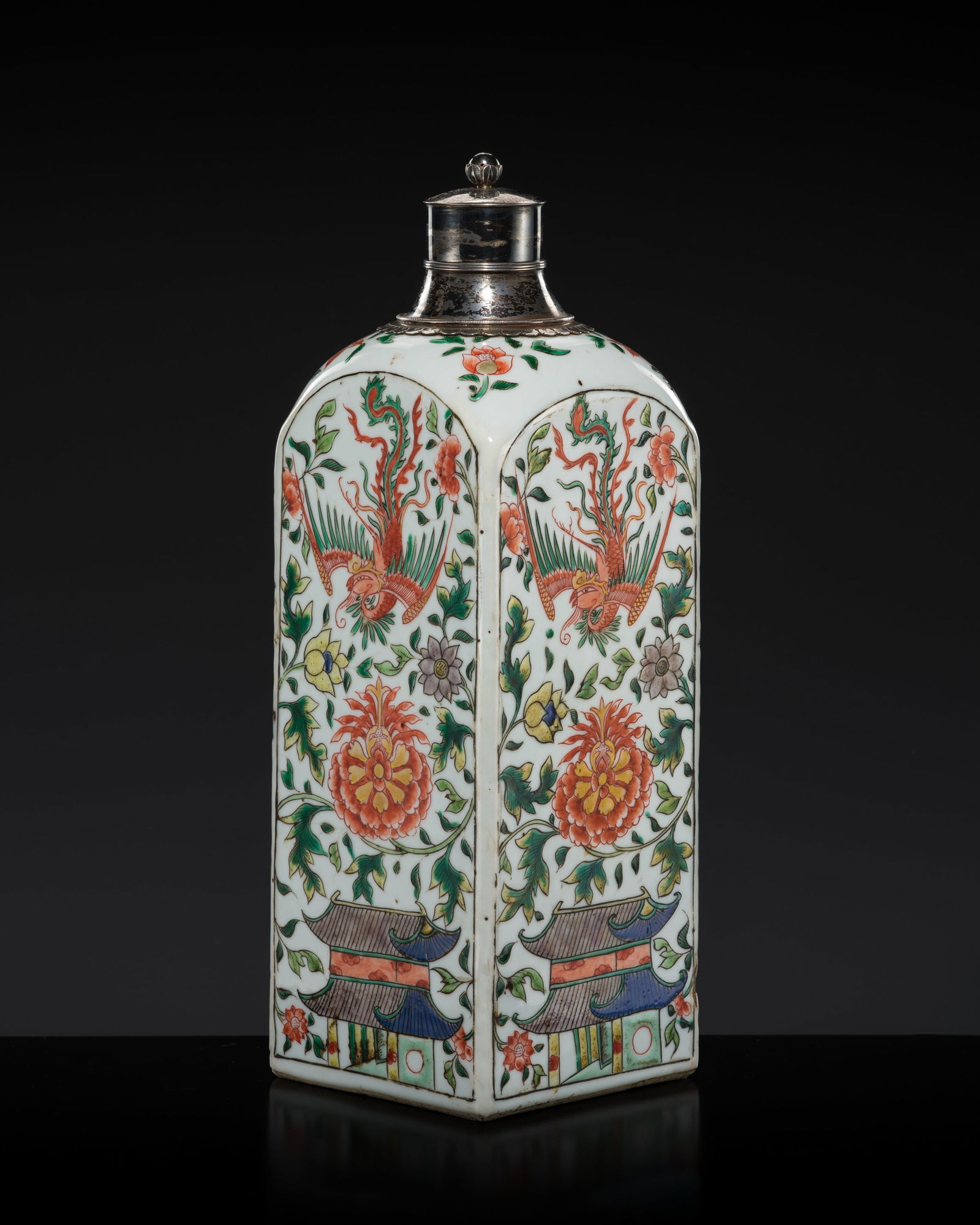 A FAMILLE-VERTE 'PHOENIX AND LOTUS' GIN BOTTLE WITH FINE SILVER MOUNTS, KANGXI PERIOD: A FAMILLE-VERTE 'PHOENIX AND LOTUS' GIN BOTTLE WITH FINE SILVER MOUNTS, KANGXI PERIOD China, 1662-1722. The silver mounts probably European and dating to the 19th century.Of upright square form with r