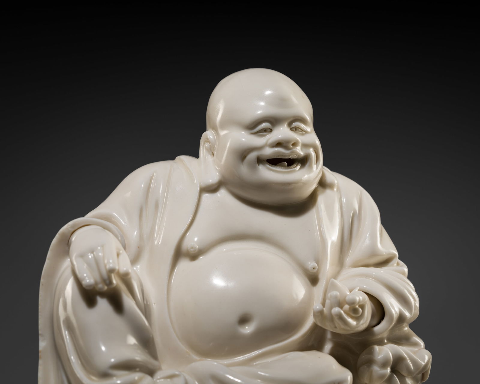 A DEHUA BLANC-DE-CHINE FIGURE OF BUDAI, 17TH-18TH CENTURY (1 of 14)