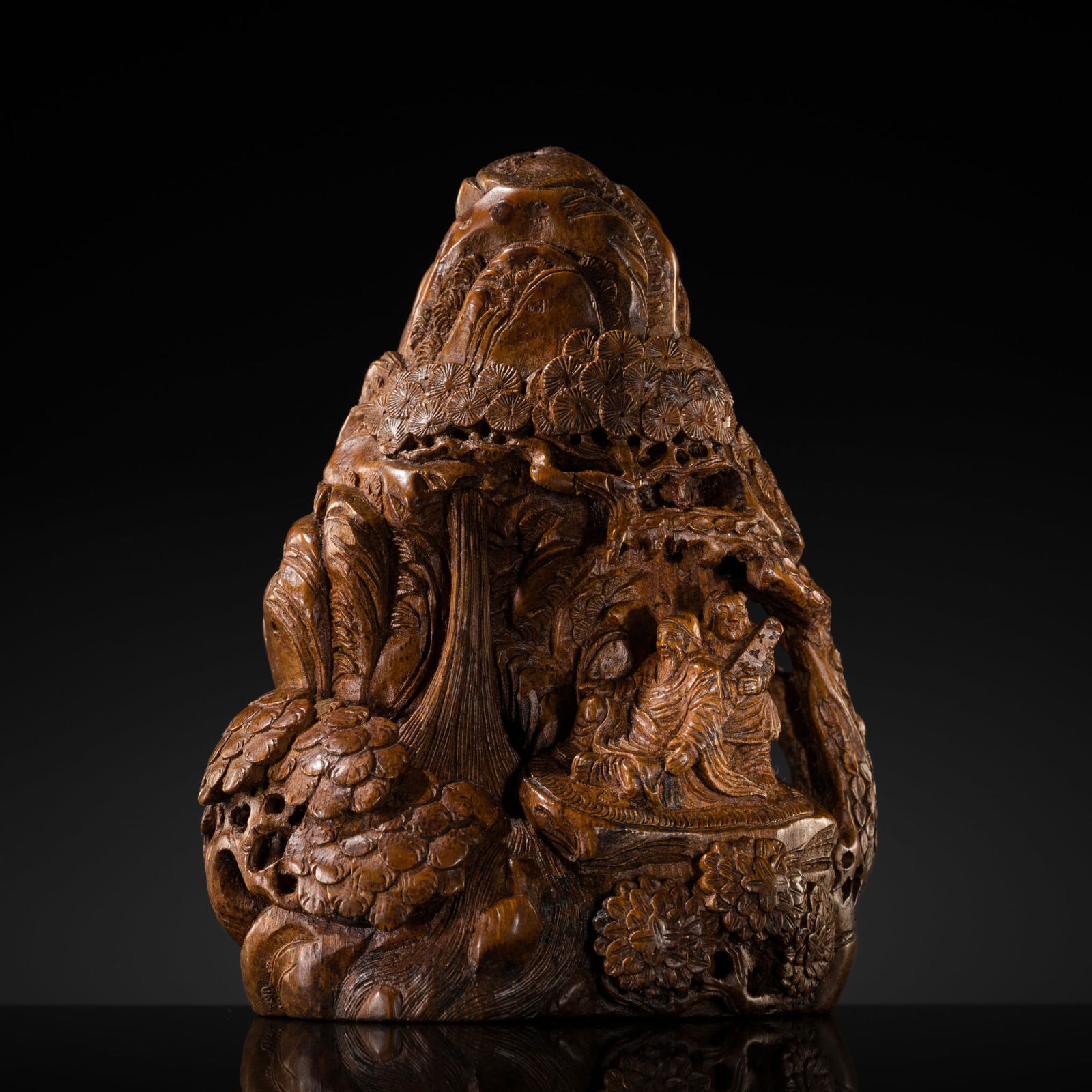 A BAMBOO ROOT 'SCHOLAR' MOUNTAIN, SIGNED SHAOXI, QING DYNASTY, 18TH-19TH CENTURY: A BAMBOO ROOT 'SCHOLAR' MOUNTAIN, SIGNED SHAOXI, QING DYNASTY, 18TH-19TH CENTURY China. Dexterously carved in openwork in the form of a rugged escarpment, with a waterfall whose finely rendered waters