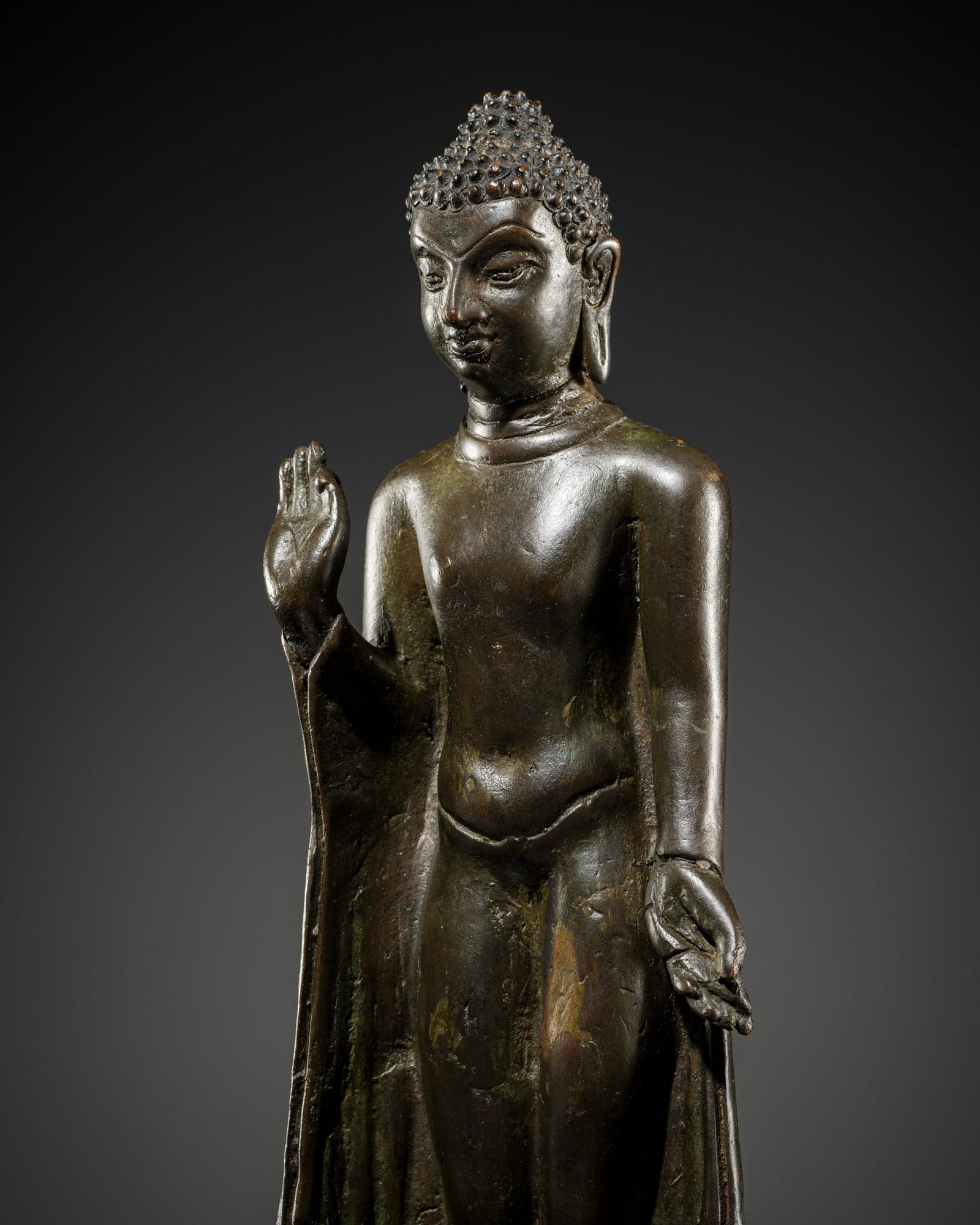 A SOLID-CAST BRONZE FIGURE OF A STANDING BUDDHA, POST-GUPTA PERIOD, EASTERN INDIA, 8TH-10TH CENTURY (1 of 12)