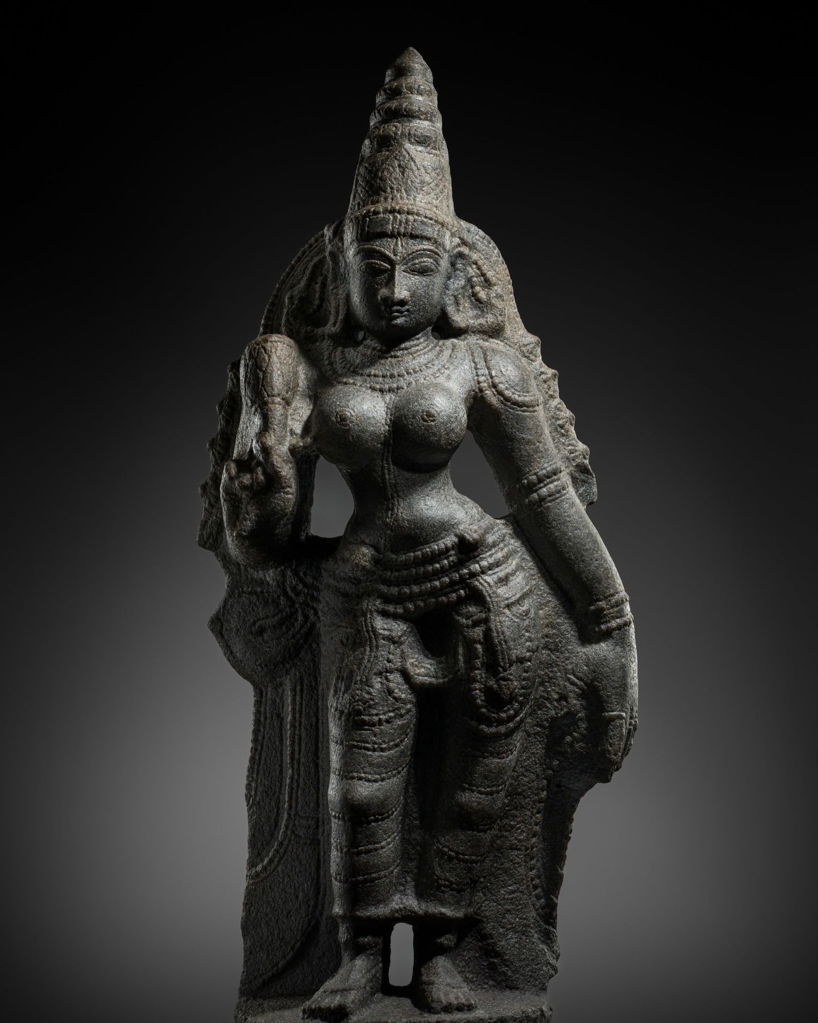 A FINE GRANITE FIGURE OF PARVATI, LATE CHOLA TO EARLY VIJAYANAGARA PERIOD, 12TH-14TH CENTURY (1 of 14)