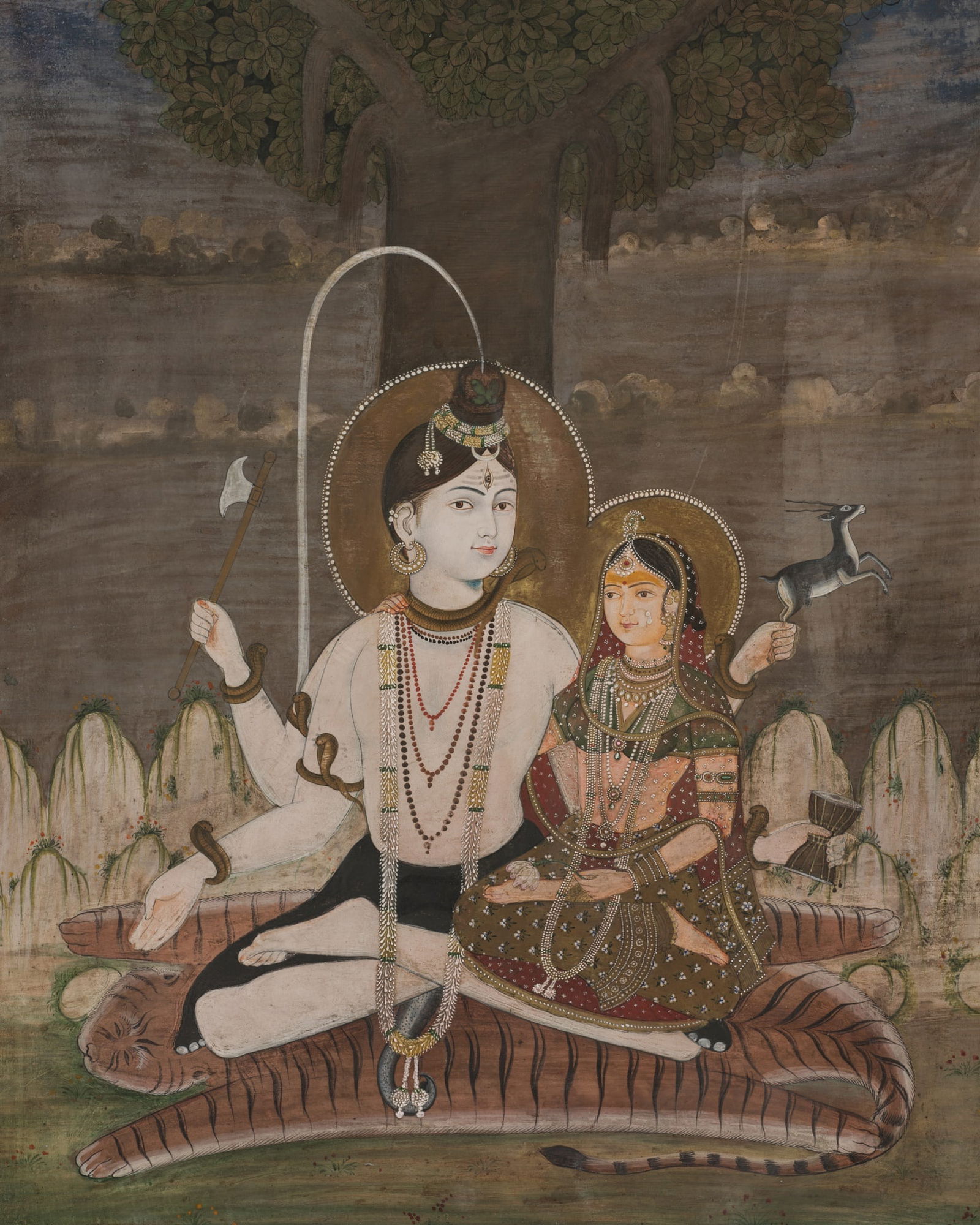 A FINE PAINTING OF SHIVA CHANDRASHEKHARA AND PARVATI, JAIPUR, 19TH: A FINE PAINTING OF SHIVA CHANDRASHEKHARA AND PARVATI, JAIPUR, 19TH India, Rajasthan. The heavenly couple seated on tiger skin under the shade of an imposing Banyan tree, the four-armed Shiva dressed i