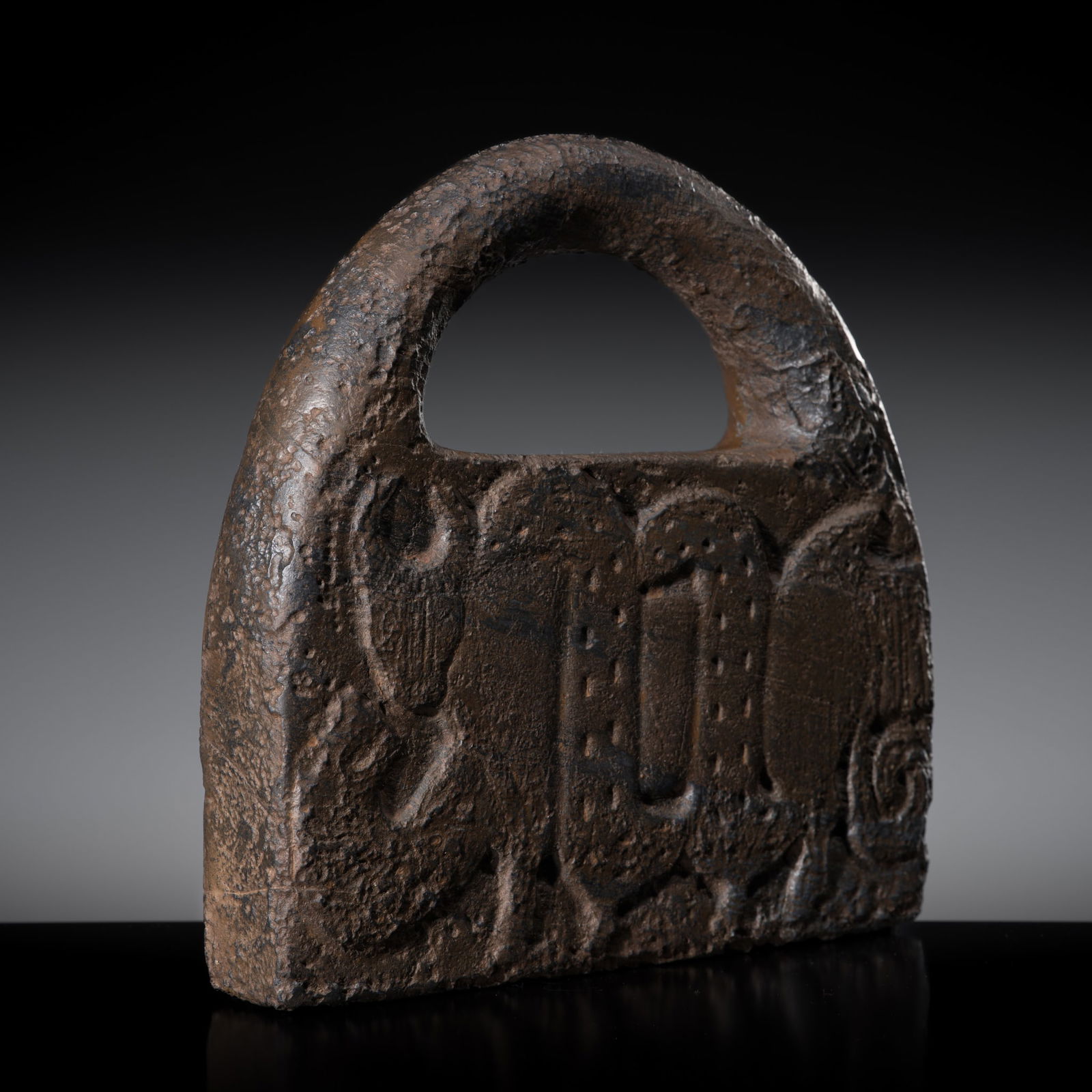A CHLORITE 'BOVINE AND SNAKE' HANDBAG WEIGHT, JIROFT CULTURE, 3RD MILLENNIUM BC: A CHLORITE 'BOVINE AND SNAKE' HANDBAG WEIGHT, JIROFT CULTURE, 3RD MILLENNIUM BC Southeastern Iran, c. 2800-2300 BC. Of gently rounded rectangular form with an overhanging rounded handle, boldly carved