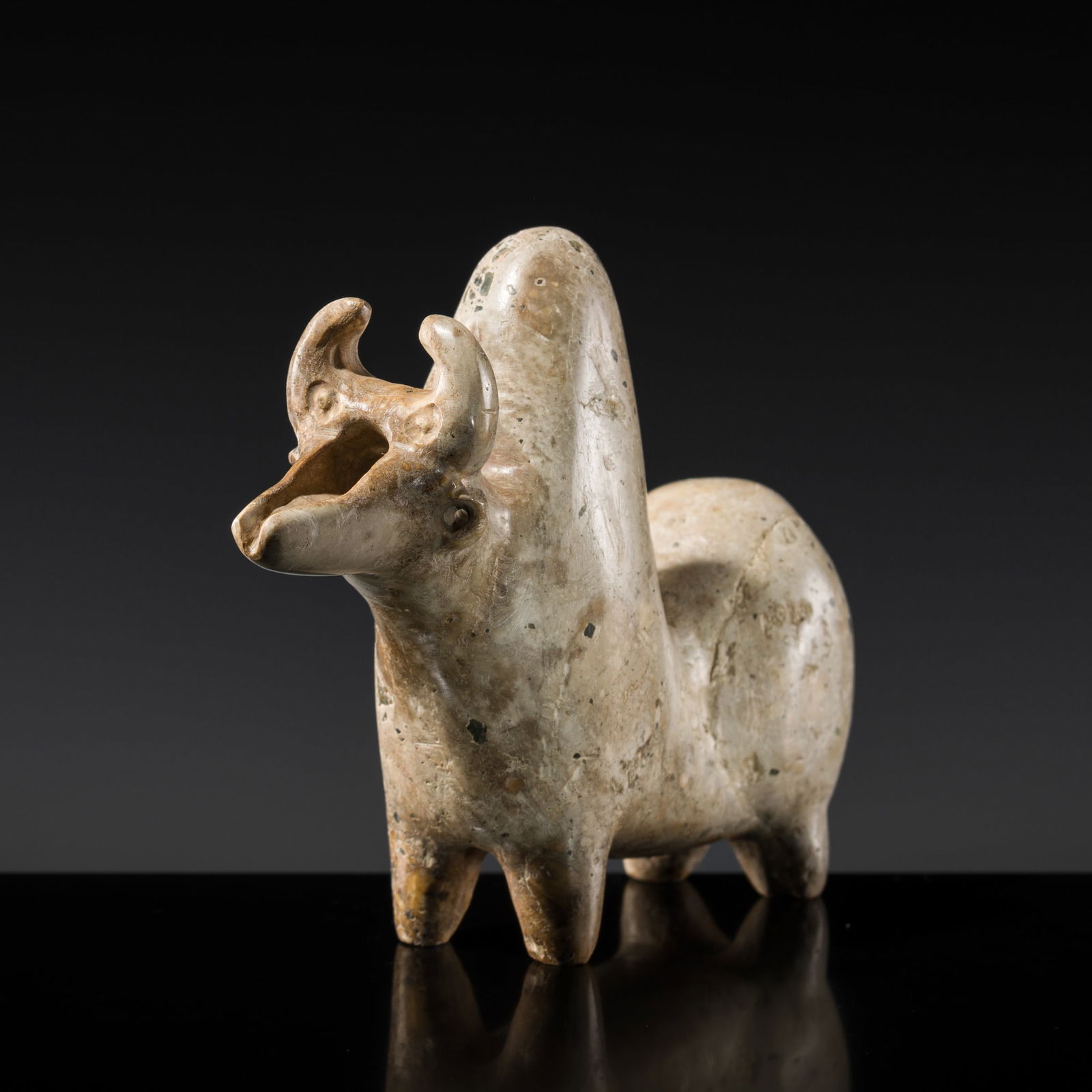 A RARE LIMESTONE FIGURE OF A ZEBU, NORTHWESTERN IRAN, CASPIAN REGION, CIRCA 1000 BC (1 of 11)