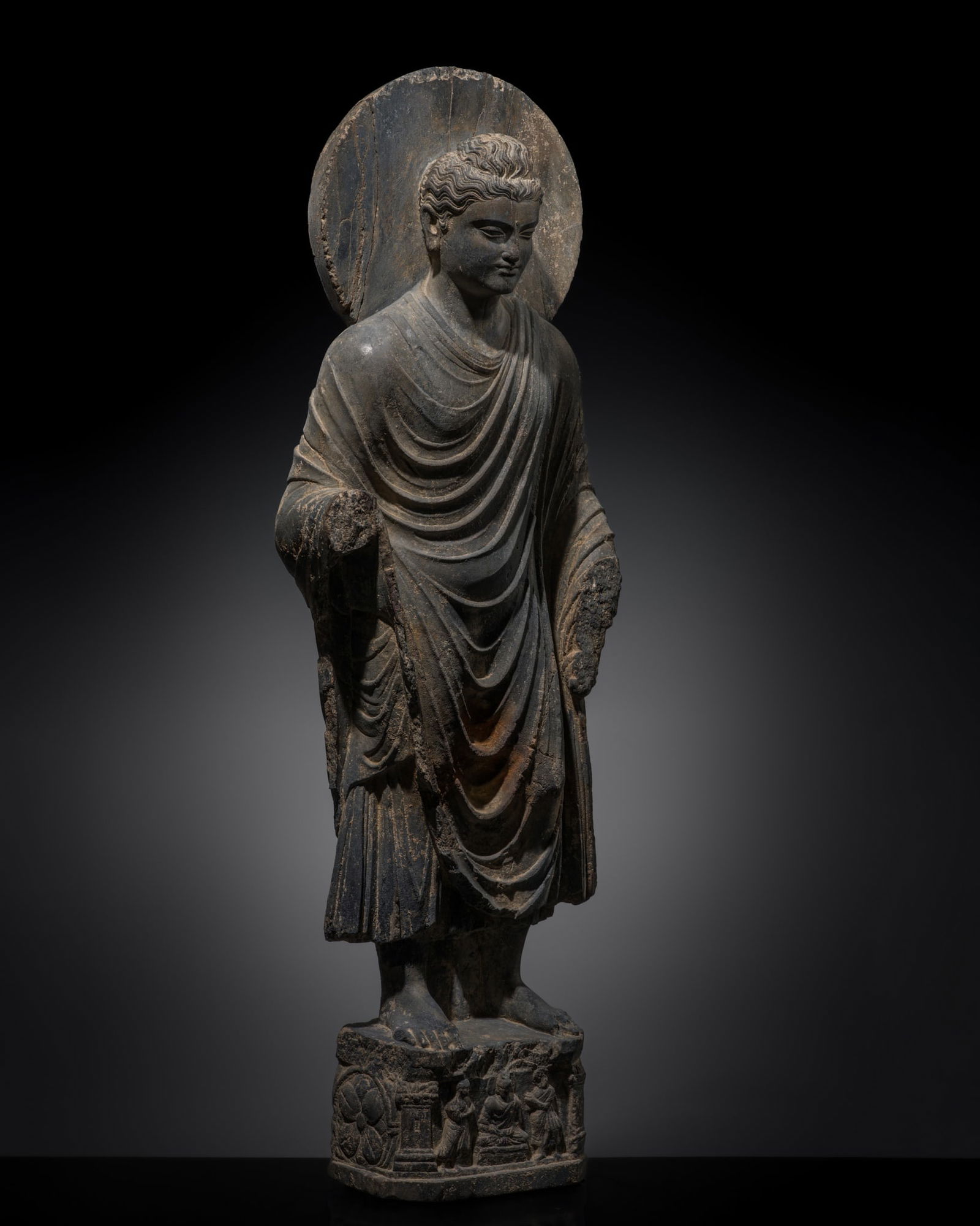 A MAGNIFICENT GRAY SCHIST FIGURE OF THE STANDING BUDDHA SHAKYAMUNI, ANCIENT REGION OF GANDHARA, (1 of 17)
