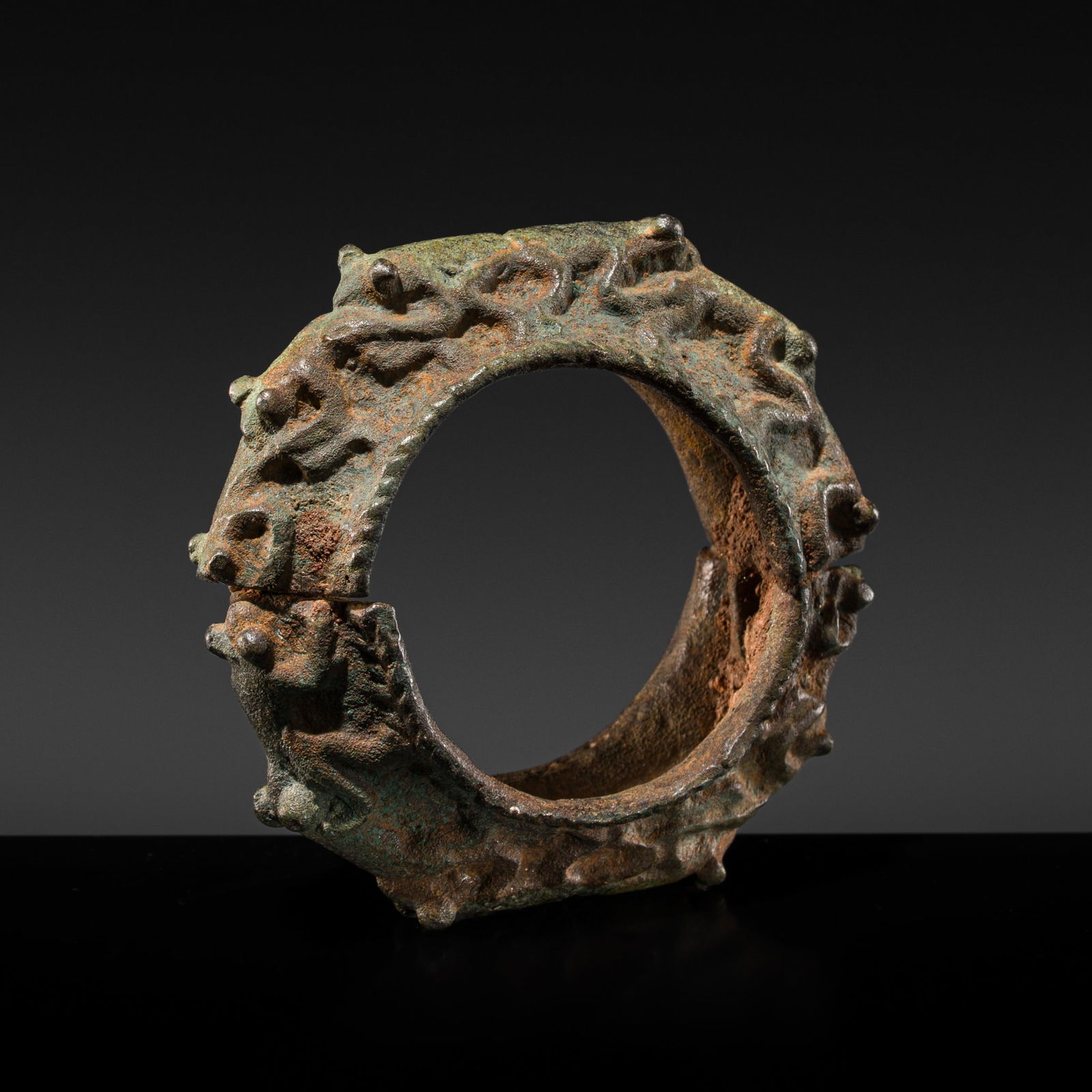 A BRONZE 'TWELVE FROG' BRACELET, DONG SON CULTURE, NORTHERN VIETNAM, CIRCA 100 BC (1 of 14)