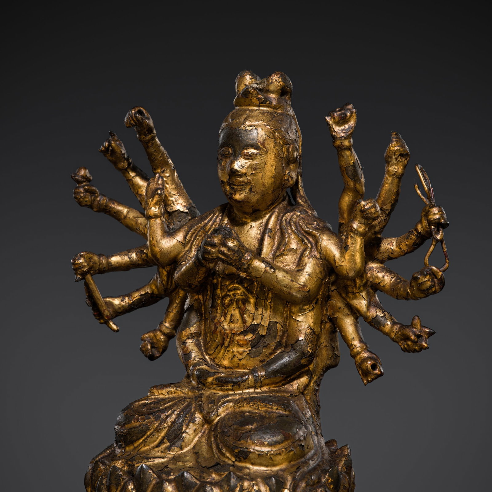 A GILT-LACQUERED BRONZE FIGURE OF CUNDI AVALOKITESHVARA, VIETNAM OR SOUTHERN CHINA, 17TH CENTURY: A GILT-LACQUERED BRONZE FIGURE OF CUNDI AVALOKITESHVARA, VIETNAM OR SOUTHERN CHINA, 17TH CENTURY Finely cast, the eighteen-armed deity seated in dhyanasana on a lotus throne supported on a red lacquer