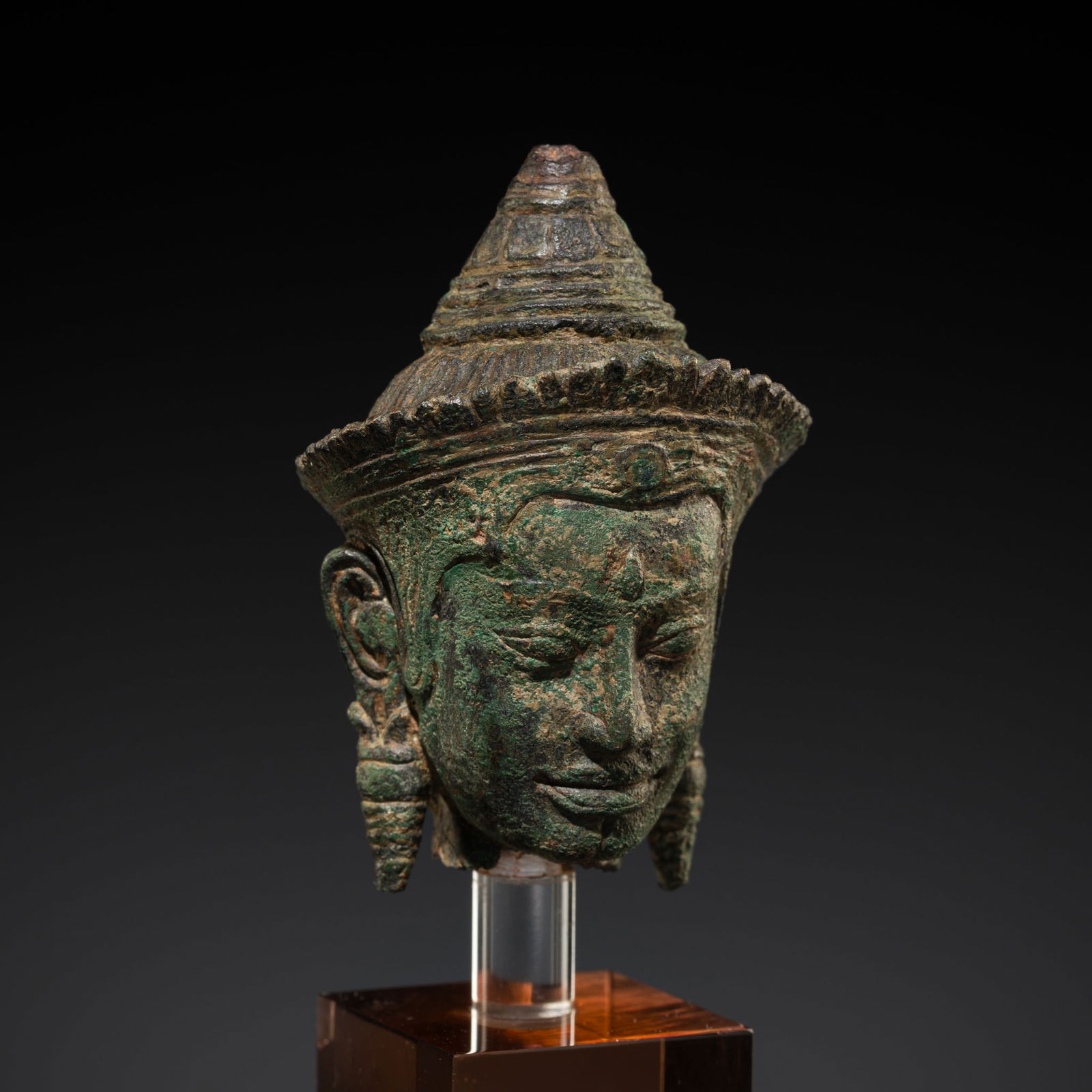 AN EXPRESSIVE BRONZE HEAD OF A DEITY, ANGKOR PERIOD, BAYON STYLE, 12TH-13TH CENTURY (1 of 10)