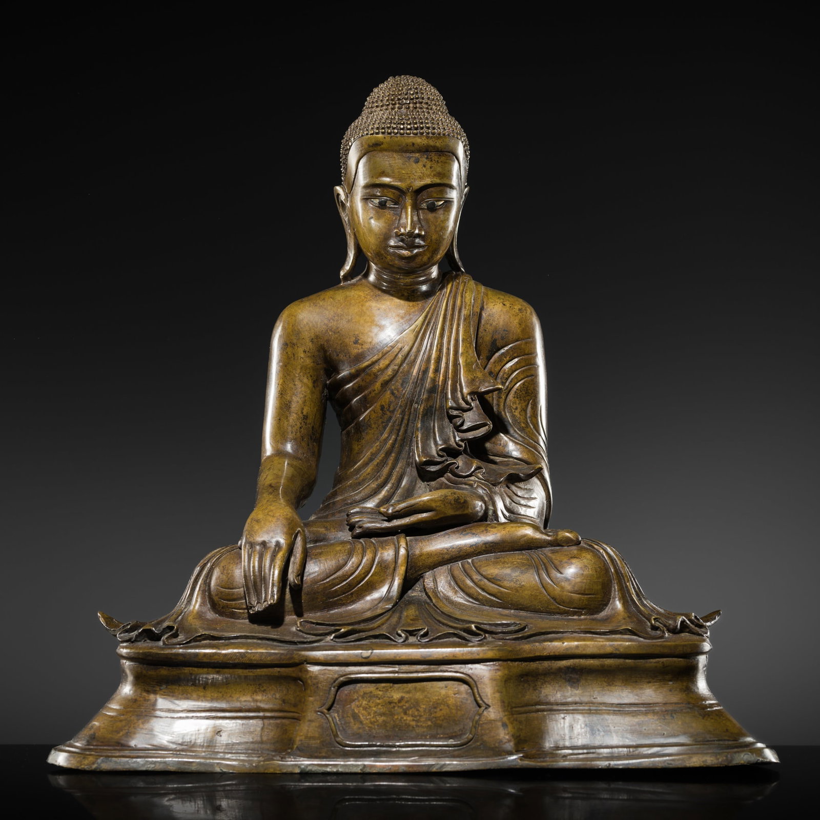 A FINE BRONZE OF THE SEATED BUDDHA, MANDALAY STYLE, KONBAUNG DYNASTY (1 of 14)
