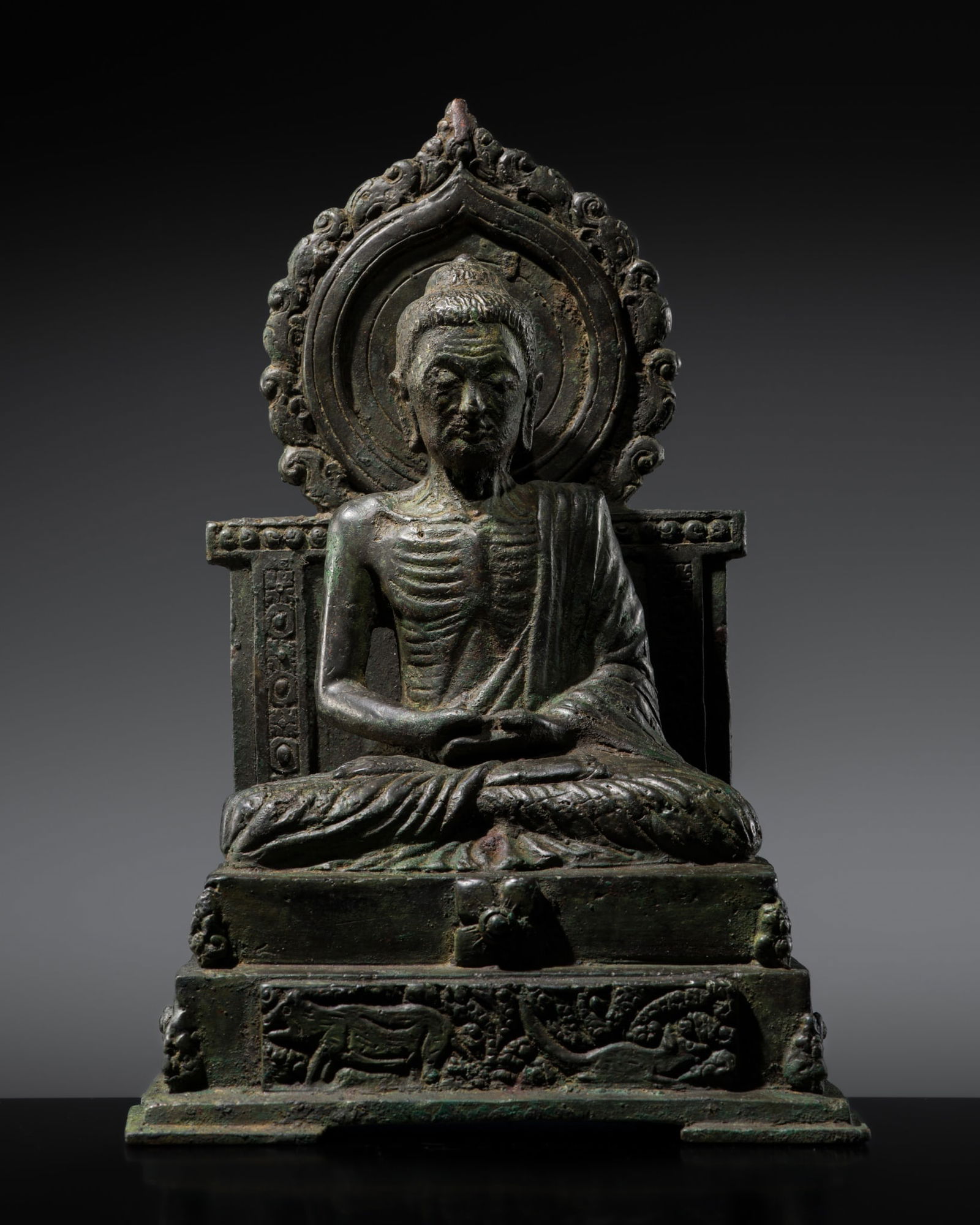 A RARE BRONZE FIGURE OF THE ASCETIC BUDDHA, SHAILENDRA DYNASTY, 8TH-9TH CENTURY (1 of 17)
