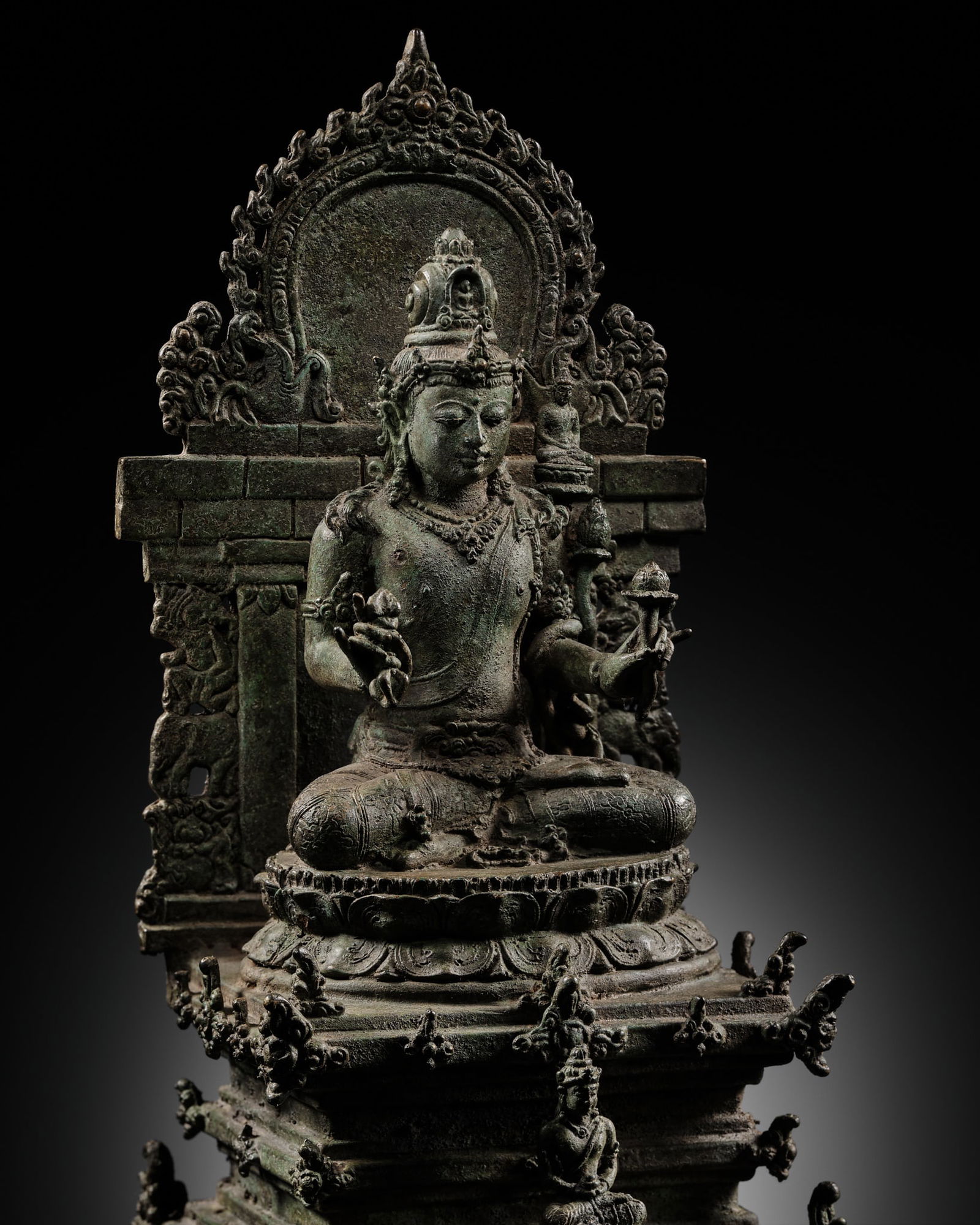 A FINE BRONZE FIGURE OF VAJRAPANI ON A THRONE, JAVA, 10TH-11TH CENTURY (1 of 17)