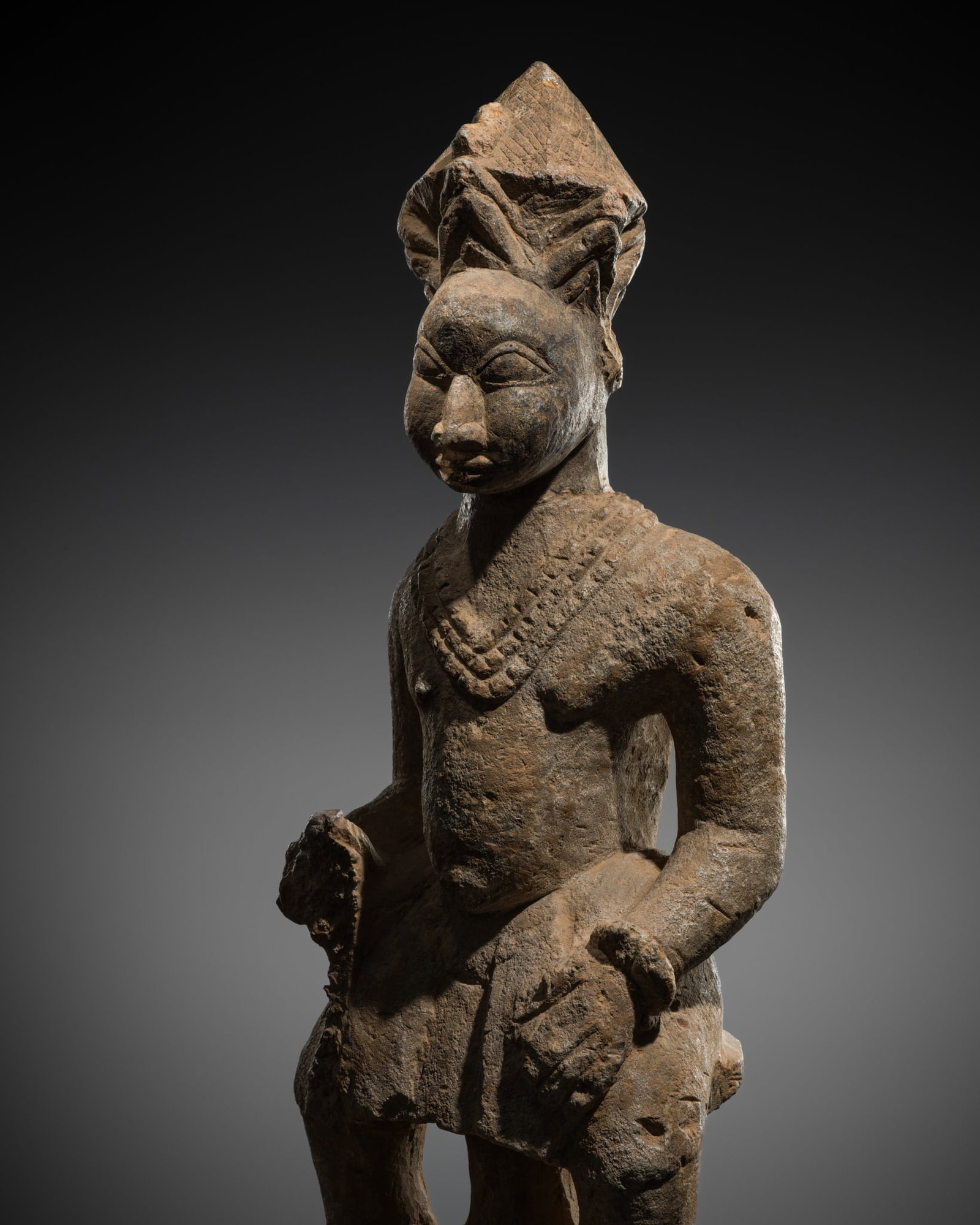 A STONE ANCESTOR FIGURE, ESIE, IGBOMINA, 18TH CENTURY (1 of 15)