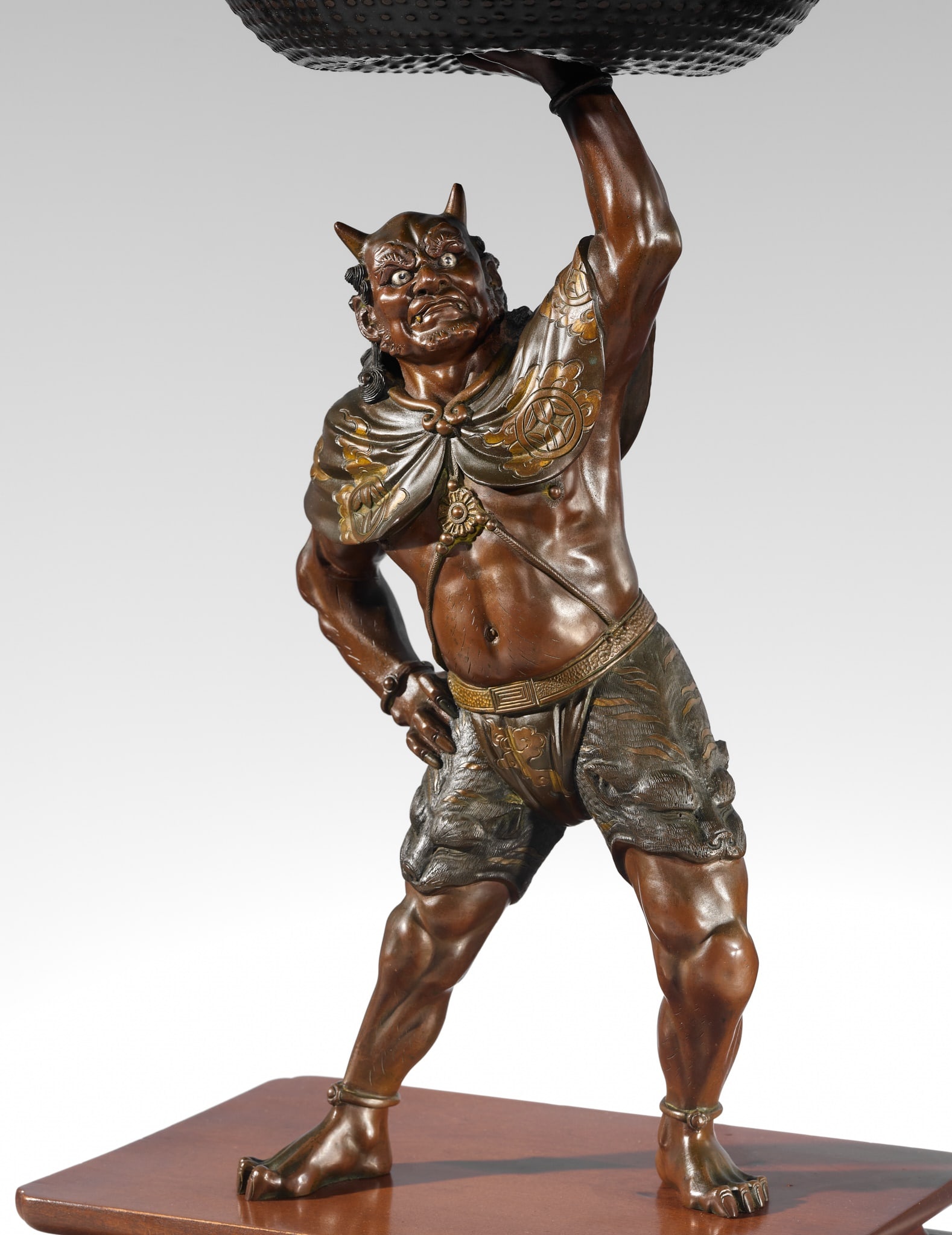AKASOFU GYOKKO: AN IMPRESSIVE AND LARGE PARCEL-GILT BRONZE FIGURE OF AN ONI AND SOUND BOWL (1 of 14)