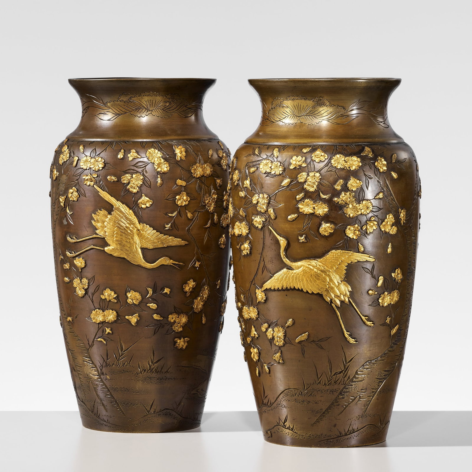 A FINE PAIR OF GOLD-INLAID BRONZE 'CRANES AMONG CHERRY BLOSSOMS' VASES (1 of 10)