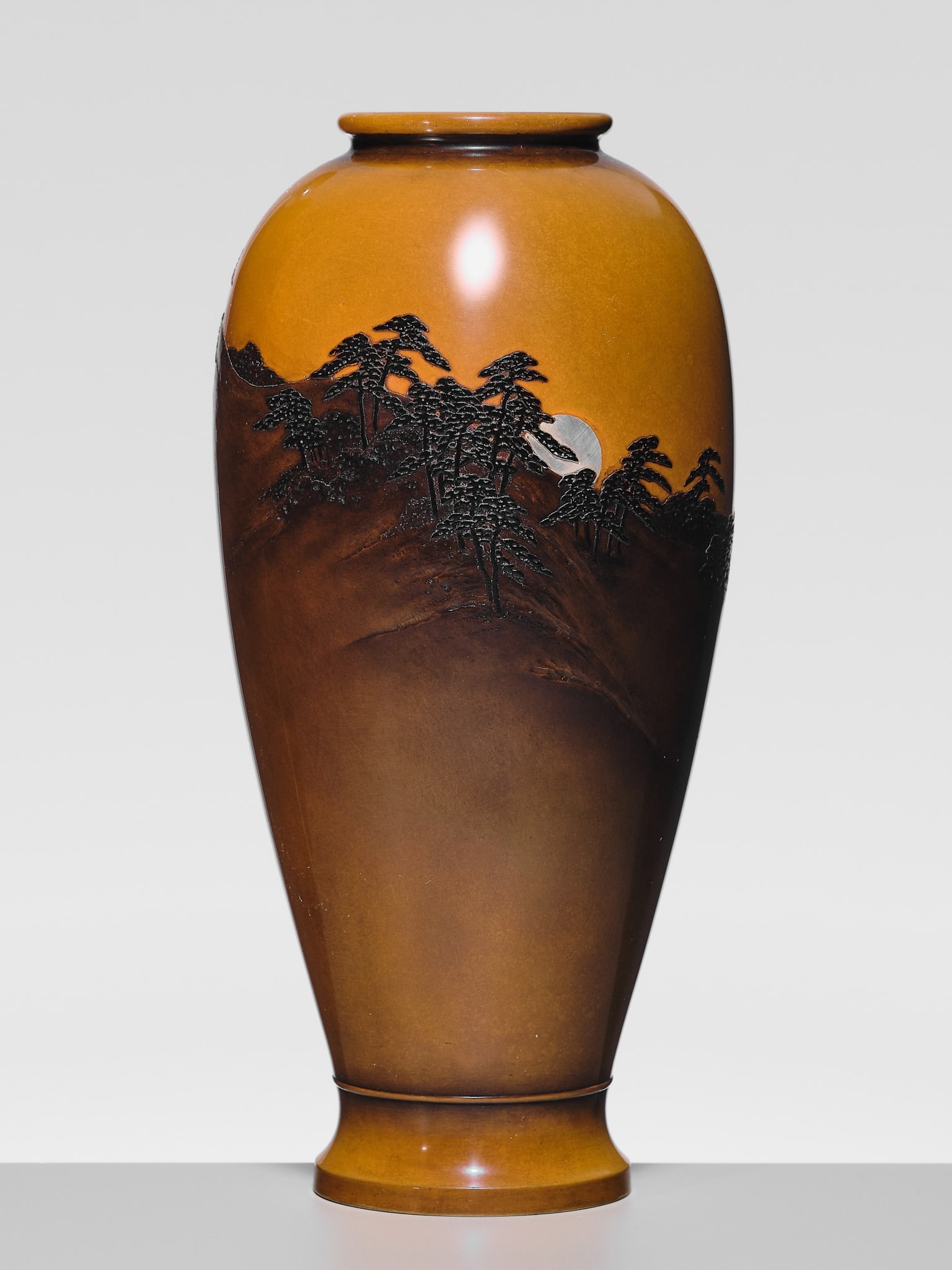 JOMI EISUKE II: A SUPERB INLAID BRONZE 'FULL MOON RISING ABOVE A PINE GROVE' VASE: JOMI EISUKE II: A SUPERB INLAID BRONZE 'FULL MOON RISING ABOVE A PINE GROVE' VASE By Jomi Eisuke II (1839-1899), sealed Jomi Japan, late 19th century, Meiji period (1868-1912) Of tall baluster form, f