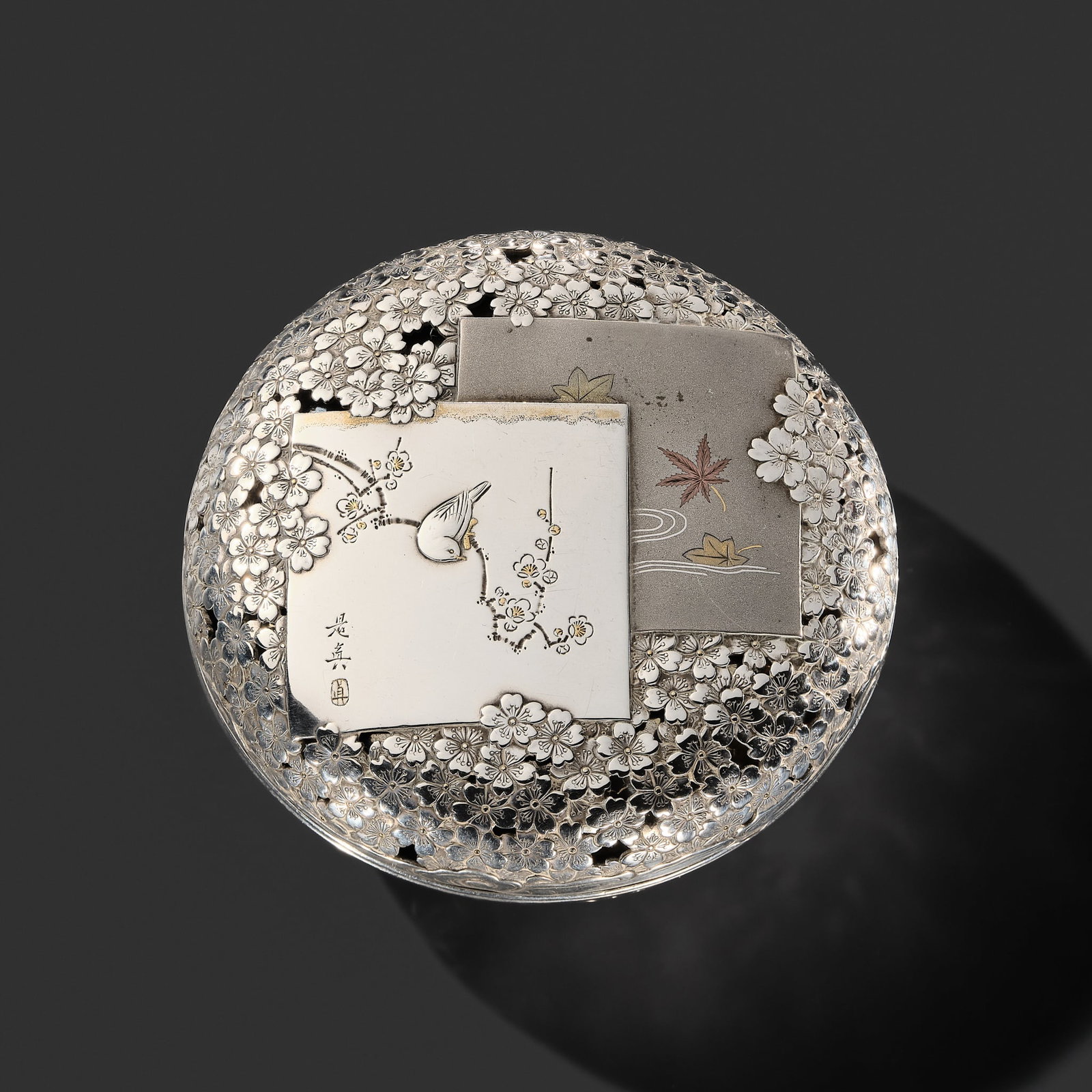 MASAYUKI: A FINE SILVER 'POEM PAPERS BY ZESHIN' KOGO (INCENSE BOX): MASAYUKI: A FINE SILVER 'POEM PAPERS BY ZESHIN' KOGO (INCENSE BOX) By Masayuki after a design by Shibata Zeshin, sealed Masayuki koku Japan, Meiji period (1868-1912) Of circular form and fitted with a