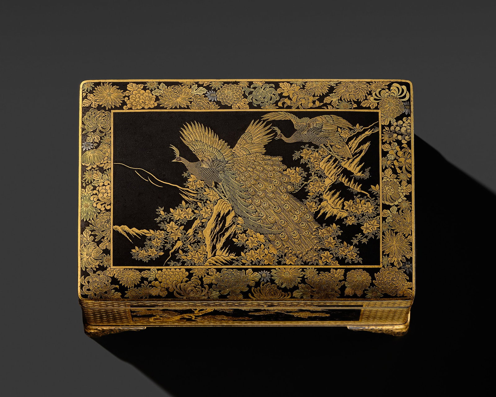 KOMAI: A SUPERB GOLD-DAMASCENED IRON 'PEACOCK AND PEAHEN' BOX AND COVER: KOMAI: A SUPERB GOLD-DAMASCENED IRON 'PEACOCK AND PEAHEN' BOX AND COVER By the Komai Company, signed Nihon koku Kyoto ju Komai sei Japan, Kyoto, Meiji period (1868-1912) The rectangular box with a hin