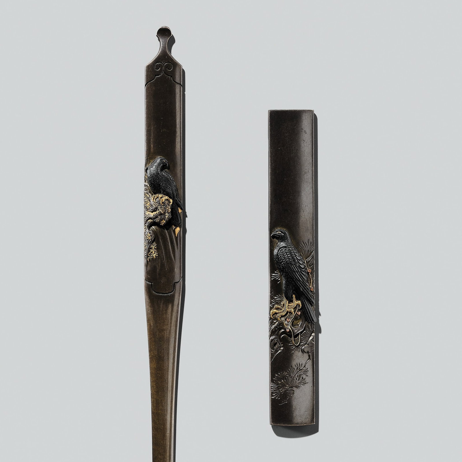 GYOKURINSAI TSUNEZANE: A FINE SHIBUICHI 'BIRDS OF PREY' FUTAKOROMONO SET (KOGAI AND KOZUKA): GYOKURINSAI TSUNEZANE: A FINE SHIBUICHI 'BIRDS OF PREY' FUTAKOROMONO SET (KOGAI AND KOZUKA) By Gyokurinsai Tsunezane, signed Gyokurinsai Tsunezane with kakihan Japan, late 18th to early 19th century,