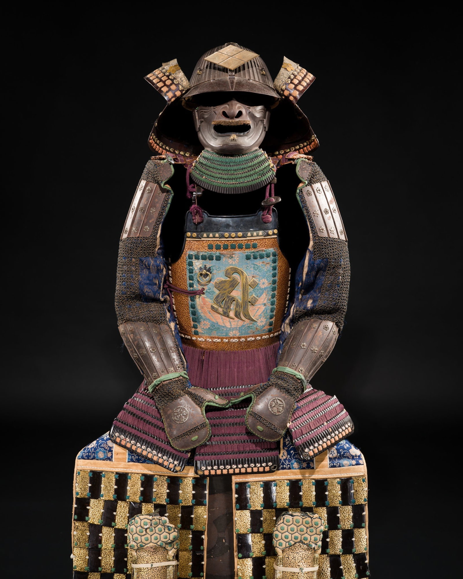 A FINE PURPLE-LACED KAGA STYLE OKEGAWA NIMAI-DO GUSOKU (TWO-PIECE CUIRASS ARMOR) AND SUJIBACHI: A FINE PURPLE-LACED KAGA STYLE OKEGAWA NIMAI-DO GUSOKU (TWO-PIECE CUIRASS ARMOR) AND SUJIBACHI KABUTO Japan, 17th-18th century, Edo period (1615-1868) The brown lacquered-iron components predomi