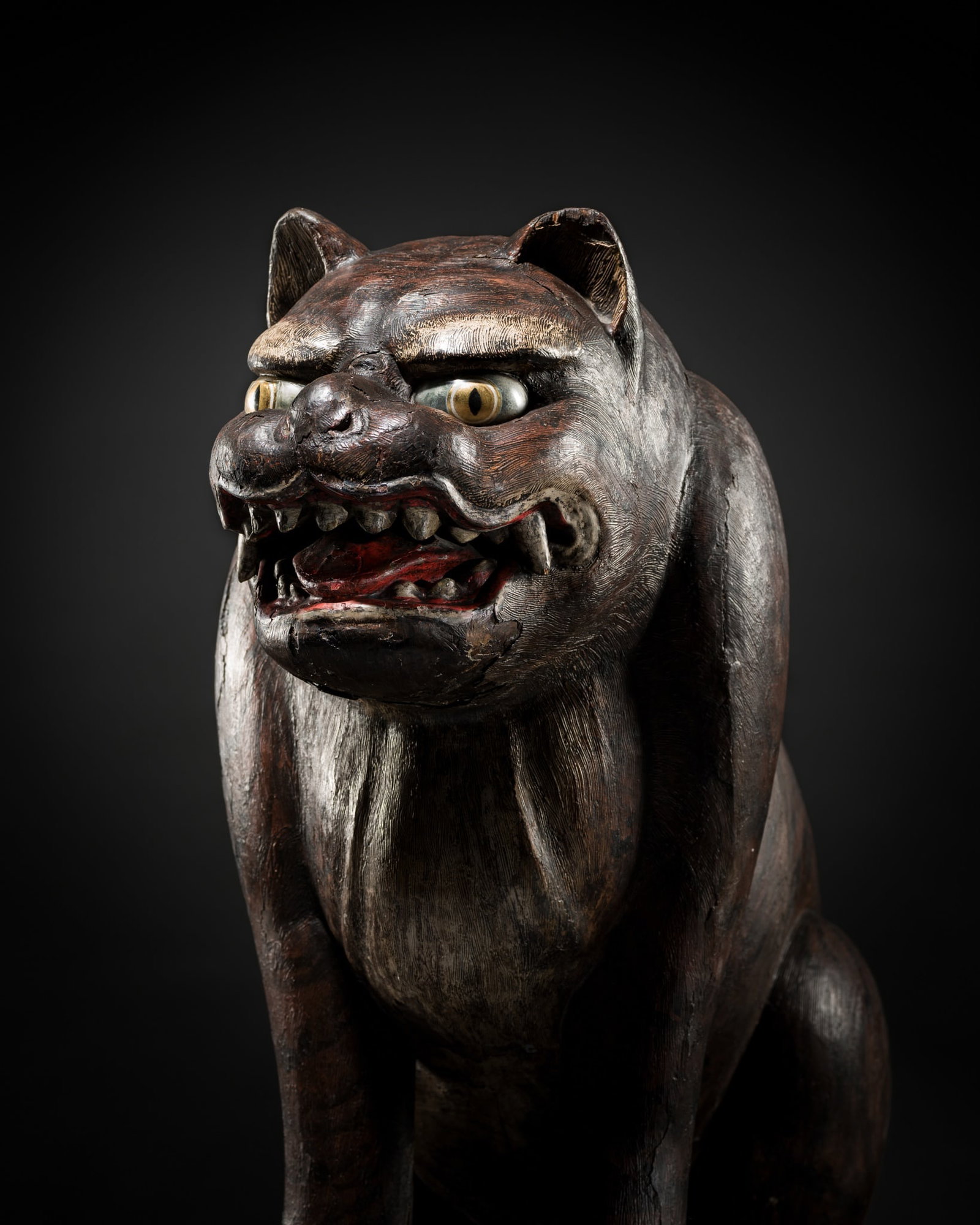 A MASSIVE (72 CM) PAINTED AND GESSOED CARVED WOOD FIGURE OF A TIGER, EDO PERIOD: A MASSIVE (72 CM) PAINTED AND GESSOED CARVED WOOD FIGURE OF A TIGER, EDO PERIOD Japan, Edo period (1615-1868) Constructed in the warihagi zukuri technique, finely carved in two sections, the ferocious