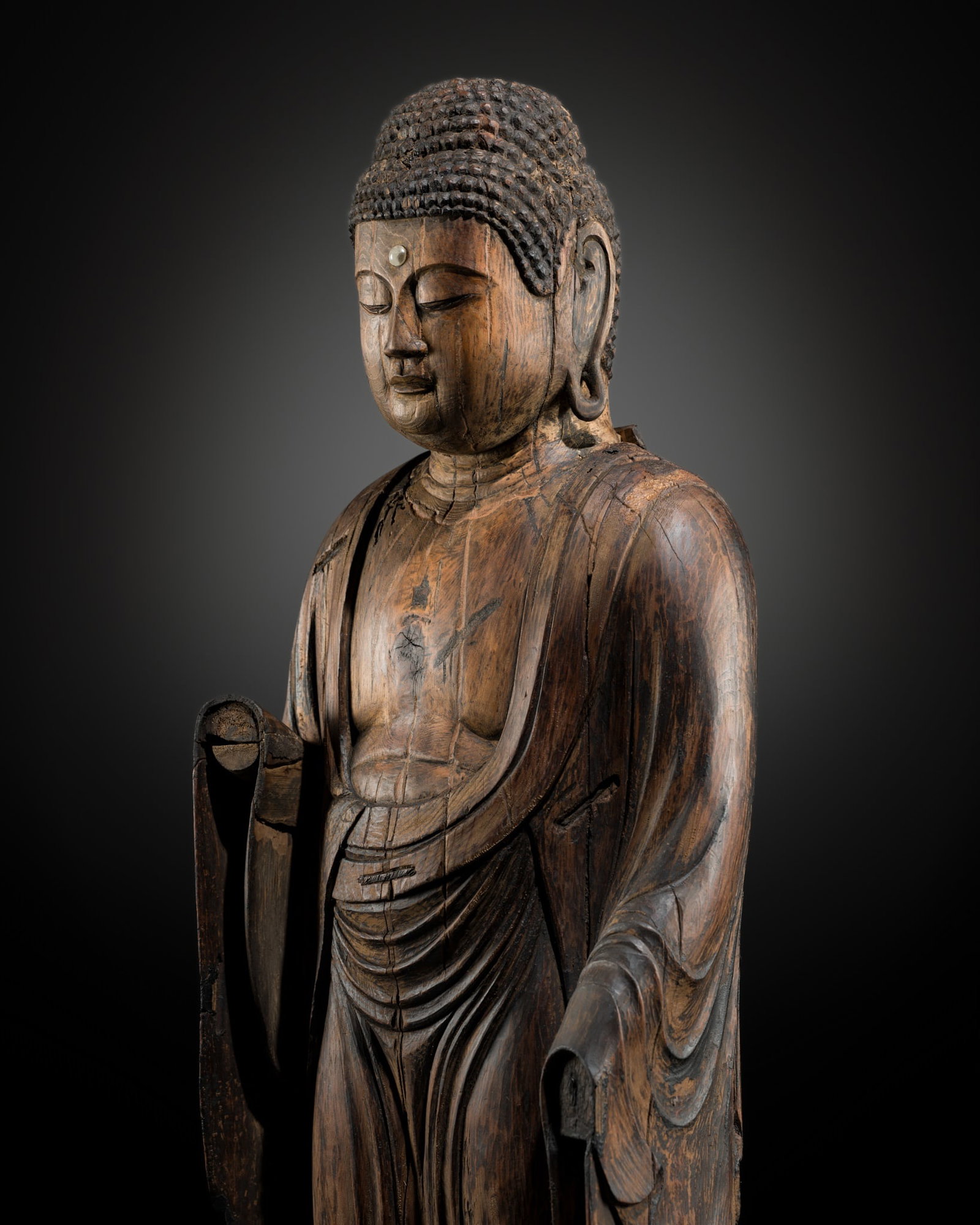 A LARGE (108 CM) AND IMPRESSIVE WOOD FIGURE OF A STANDING AMIDA NYORAI, LATE HEIAN TO EARLY KAMAKURA: A LARGE (108 CM) AND IMPRESSIVE WOOD FIGURE OF A STANDING AMIDA NYORAI, LATE HEIAN TO EARLY KAMAKURA PERIOD Japan, 12th-13th century, late Heian (794-1185) to early Kamakura period (1185-1333) O