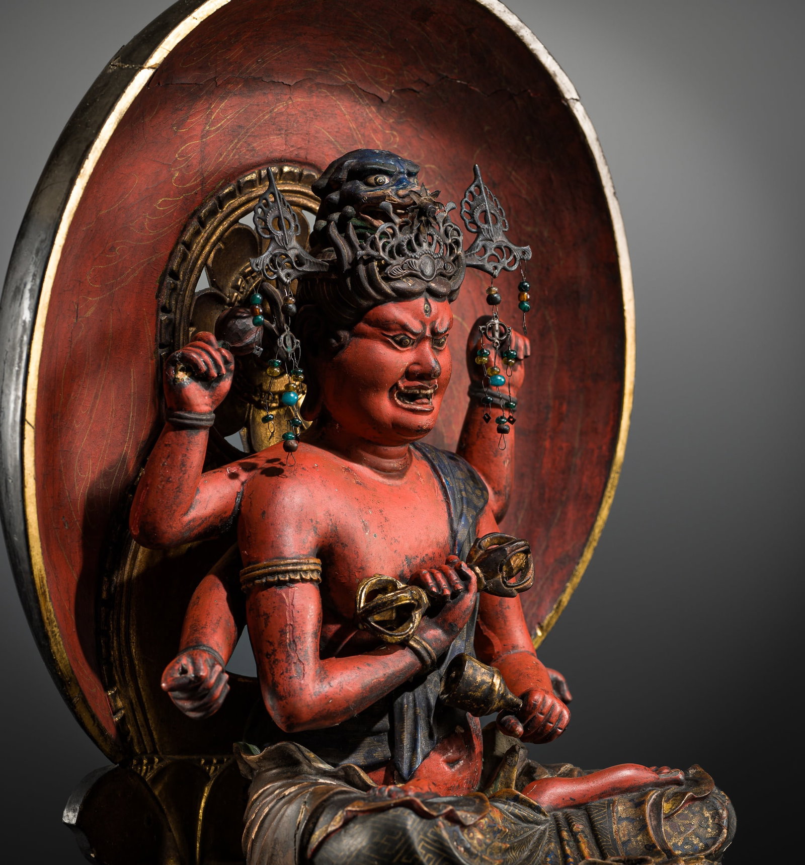 AN IMPRESSIVE GILT AND POLYCHROMED WOOD FIGURE OF AIZEN MYO-O, MUROMACHI PERIOD (1 of 12)