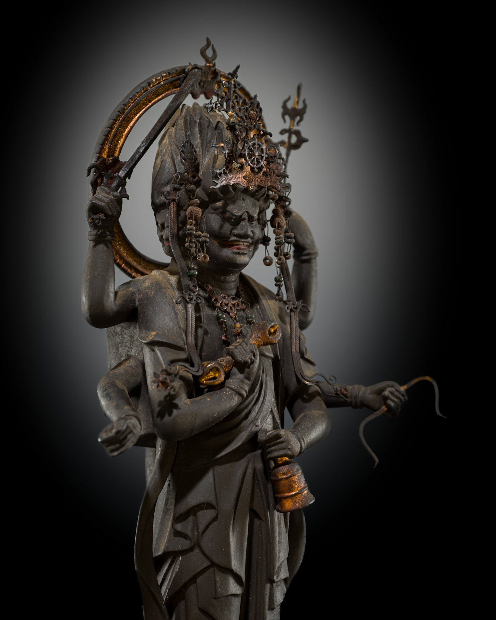 A GILT AND POLYCHROME WOOD FIGURE OF KONGOYASHA MYO-O (VAJRAYAKSHA), MUROMACHI PERIOD: A GILT AND POLYCHROME WOOD FIGURE OF KONGOYASHA MYO-O (VAJRAYAKSHA), MUROMACHI PERIOD Japan, 16th century, Muromachi period (1333-1573) Finely carved, the six-armed deity holding a vajra and bell of g