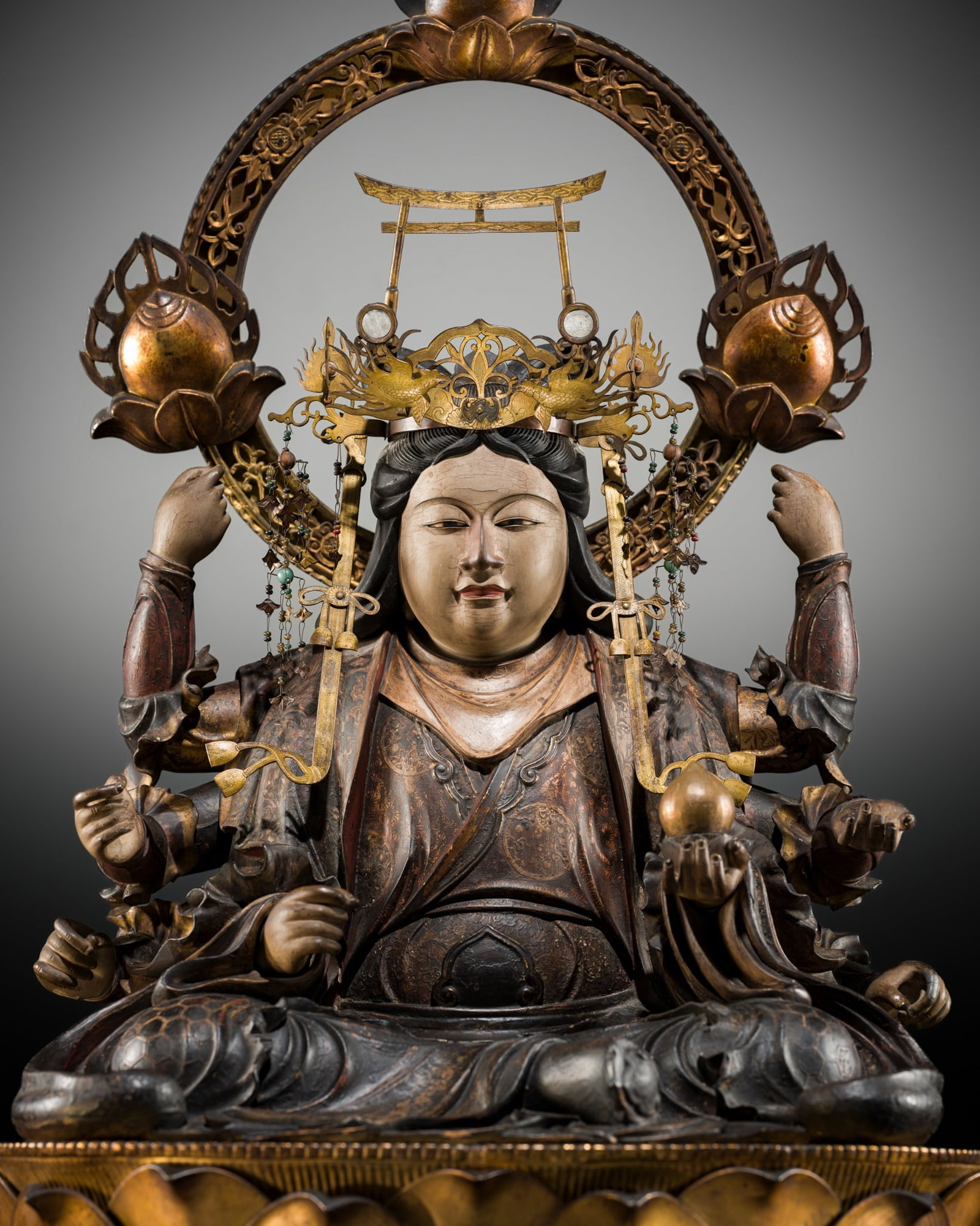 A LARGE (90 CM) AND IMPRESSIVE GILT AND POLYCHROME WOOD FIGURE OF UGA BENZAITEN, 16TH CENTURY: A LARGE (90 CM) AND IMPRESSIVE GILT AND POLYCHROME WOOD FIGURE OF UGA BENZAITEN, 16TH CENTURY Japan, 16th century, Muromachi period (1333-1573) Finely carved and richly decorated with polychrome pigme