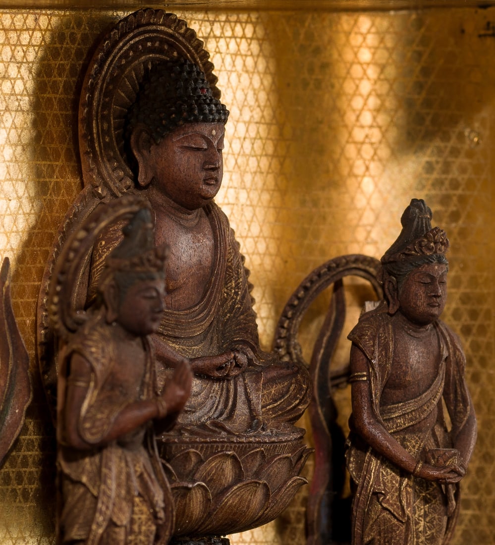 A MINIATURE GILT-LACQUERED WOOD ZUSHI (PORTABLE BUDDHIST SHRINE) WITH A FINE AMIDA TRIAD, EDO PERIOD: A MINIATURE GILT-LACQUERED WOOD ZUSHI (PORTABLE BUDDHIST SHRINE) WITH A FINE AMIDA TRIAD, EDO PERIOD Japan, 18th-19th century, Edo period (1615-1868) The figure is finely carved and depicts the seated