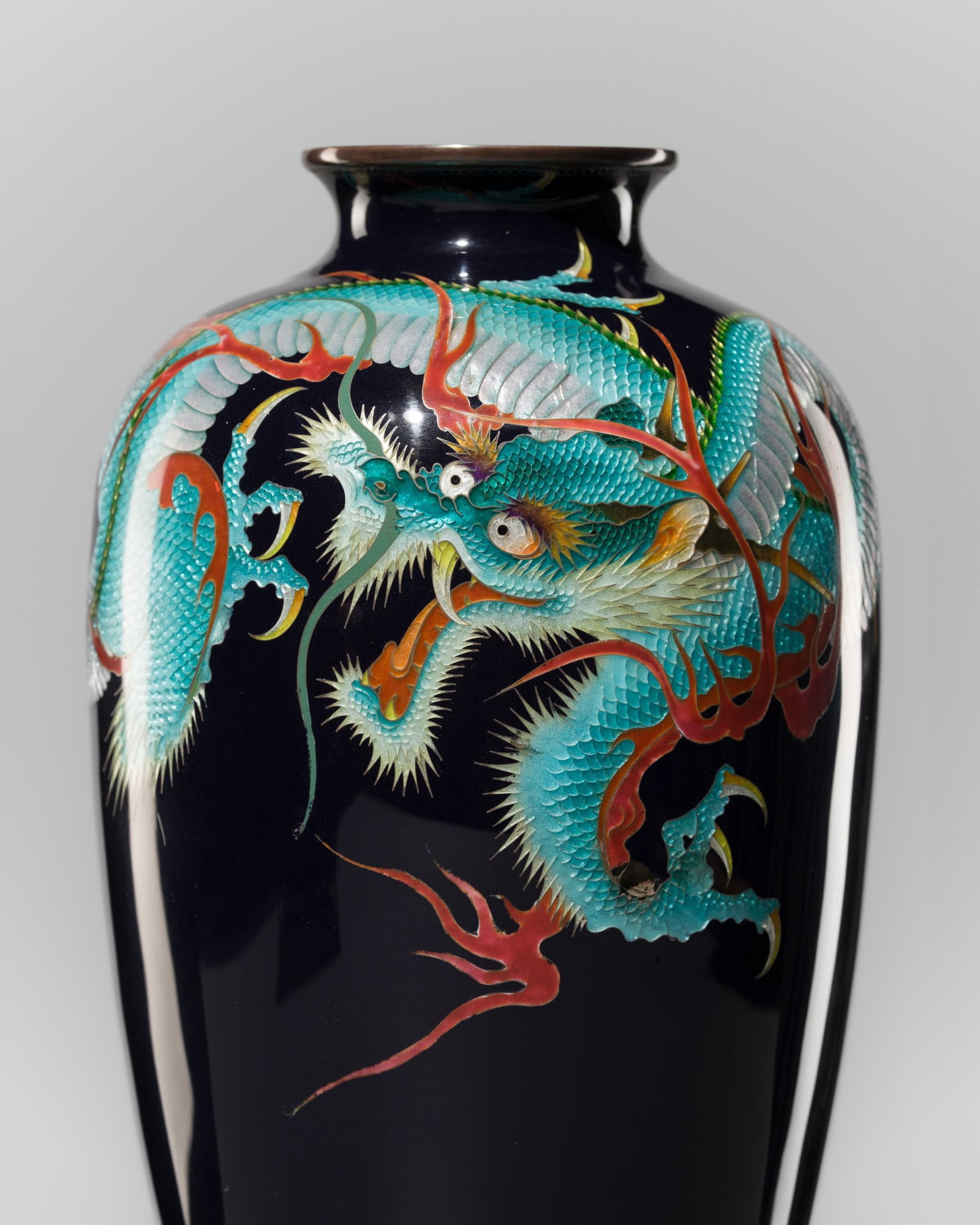 A LARGE AND IMPRESSIVE CLOISONNE ENAMEL GINBARI 'DRAGON' VASE, ATTRIBUTED TO THE WORKSHOP OF KUMENO: A LARGE AND IMPRESSIVE CLOISONNE ENAMEL GINBARI 'DRAGON' VASE, ATTRIBUTED TO THE WORKSHOP OF KUMENO TEITARO Japan, Meiji period (1868-1912) The large vase is of baluster form, rising from a circular f