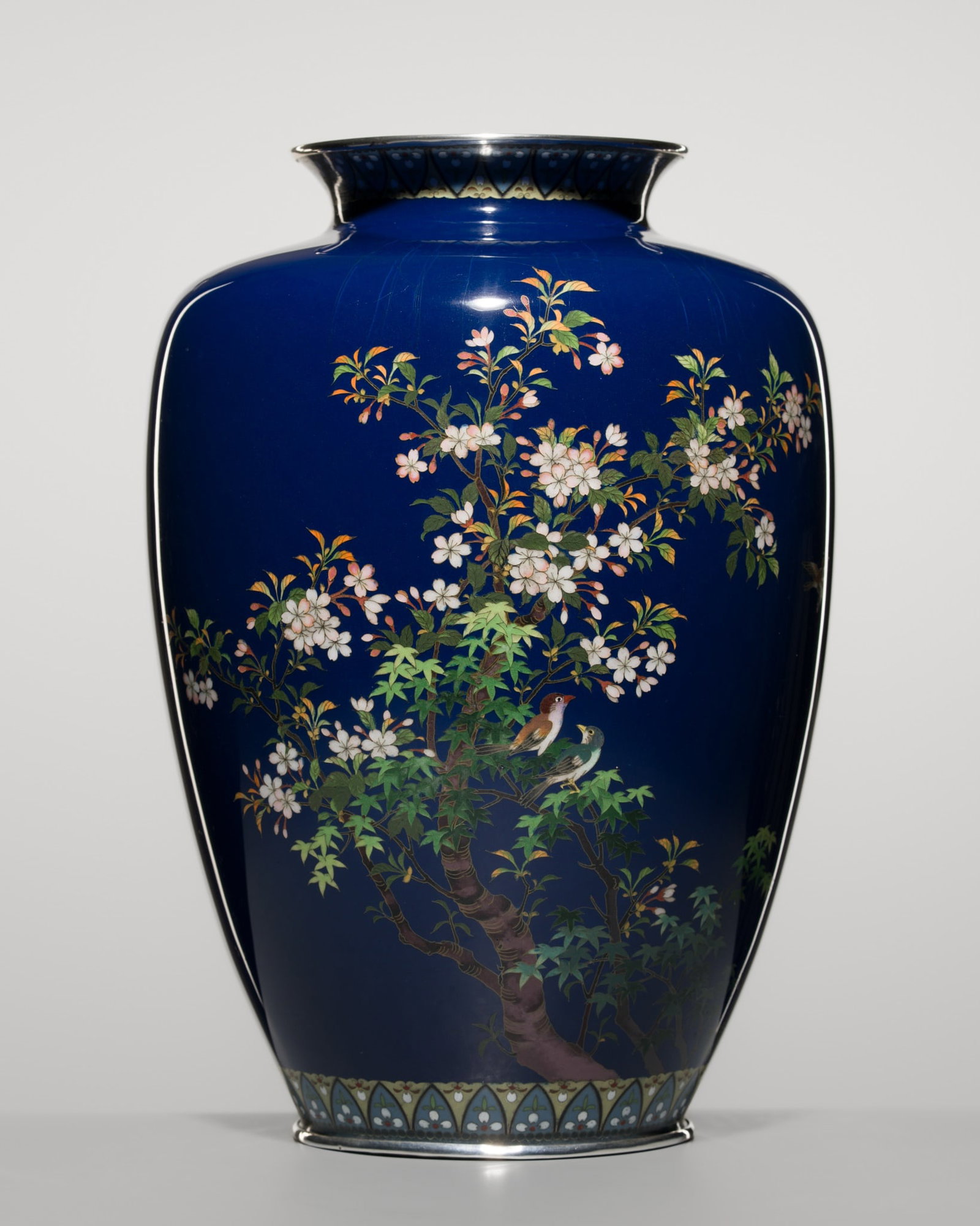 A FINE AND LARGE CLOISONNE-ENAMEL 'BIRDS AND SAKURA' VASE, ATTRIBUTED TO THE WORKSHOP OF HAYASHI: A FINE AND LARGE CLOISONNE-ENAMEL 'BIRDS AND SAKURA' VASE, ATTRIBUTED TO THE WORKSHOP OF HAYASHI KODENJI Japan, Meiji period (1868-1912) Of baluster form, the exterior finely worked with silver wire o