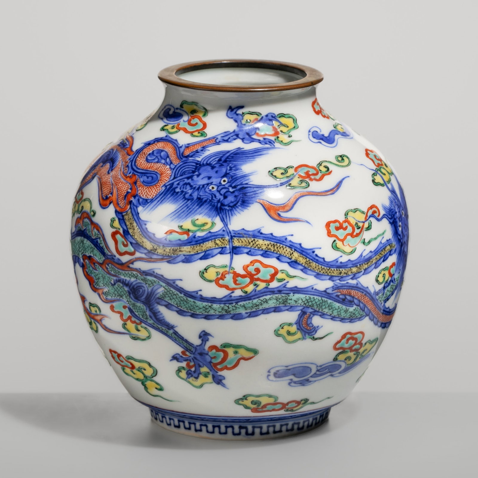 MAKUZU KOZAN I: A STUDIO PORCELAIN 'WUCAI DRAGONS' VASE: MAKUZU KOZAN I: A STUDIO PORCELAIN 'WUCAI DRAGONS' VASE By Makuzu Kozan I (1842-1916), signed Kozan sei Japan, late 19th to early 20th century, Meiji period (1868-1912) The globular body ri