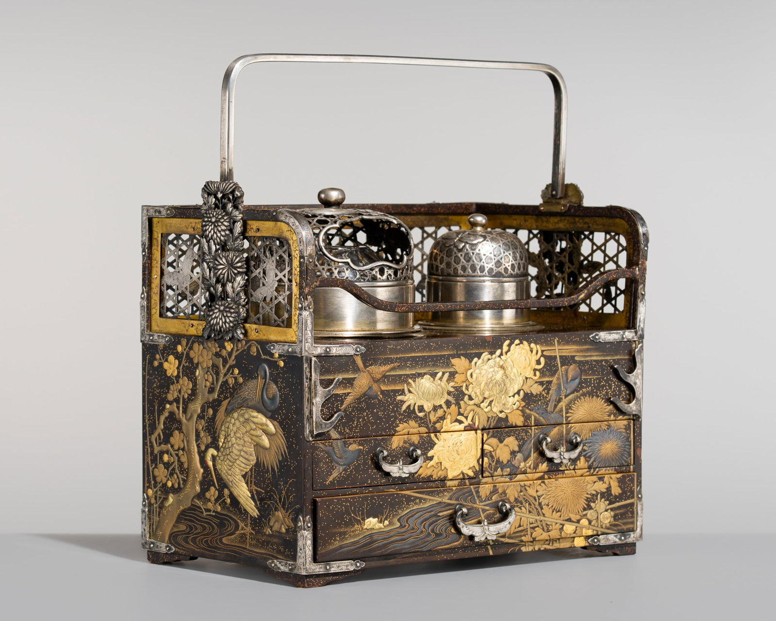 A FINE SILVER-FITTED LACQUER 'SEASONAL BLOSSOMS AND BIRDS' TABAKO-BON (SMOKING SET): A FINE SILVER-FITTED LACQUER 'SEASONAL BLOSSOMS AND BIRDS' TABAKO-BON (SMOKING SET) Japan, 19th century, late Edo (1615-1868) to Meiji period (1868-1912) Of typical rectangular form, the box fitted wi