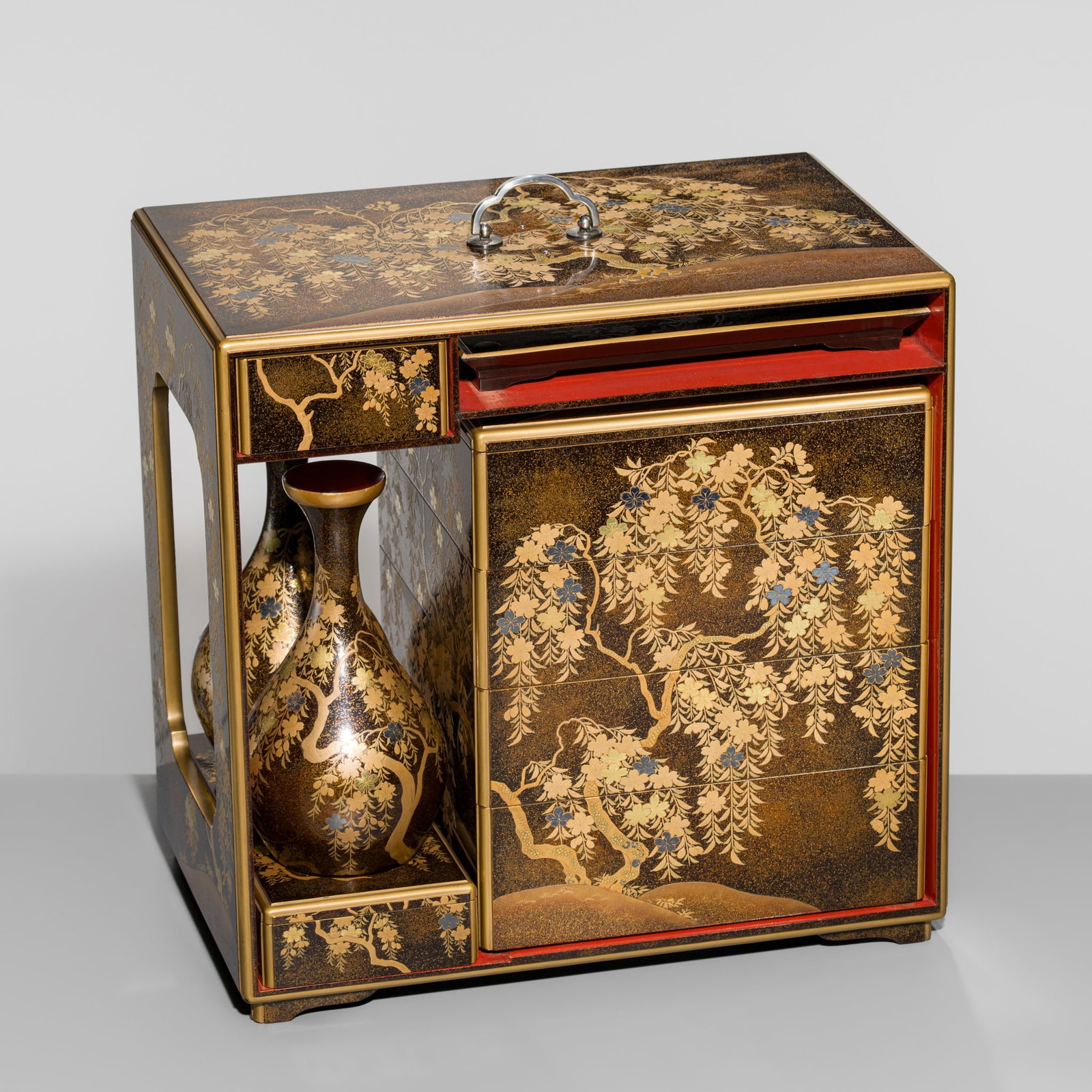 A MAGNIFICENT GOLD-LACQUER 'CHERRY BLOSSOMS' HANAMI SAGE-JUBAKO (PORTABLE PICNIC SET FOR CHERRY: A MAGNIFICENT GOLD-LACQUER 'CHERRY BLOSSOMS' HANAMI SAGE-JUBAKO (PORTABLE PICNIC SET FOR CHERRY BLOSSOM VIEWING) Japan, late 19th century, late Edo period (1615-1868) to early Meiji period (1868-1912)