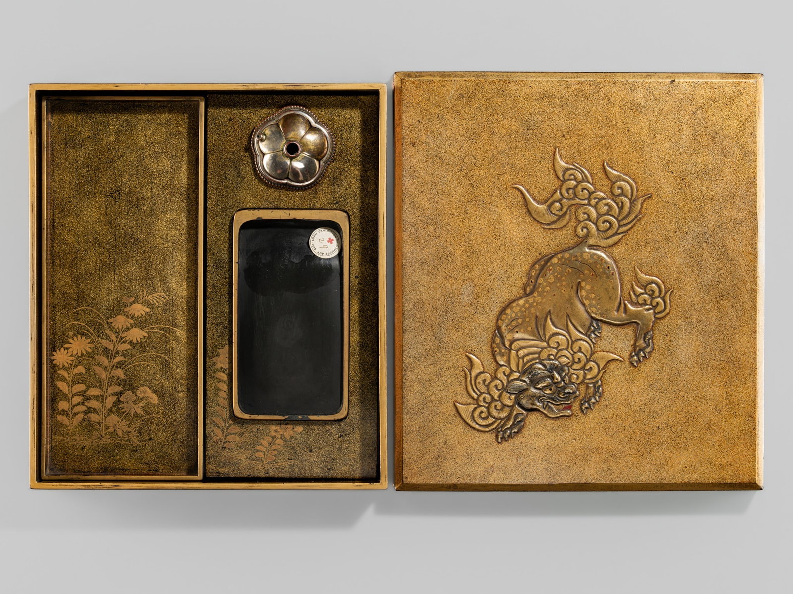 A FINE LACQUER 'SHISHI AND CRANES' SUZURIBAKO (WRITING BOX): A FINE LACQUER 'SHISHI AND CRANES' SUZURIBAKO (WRITING BOX) Japan, 17th century, early Edo period (1615-1868) Published: Henri L. Joly and Kumasaku Tomita (1915), Japanese Art and Handicra